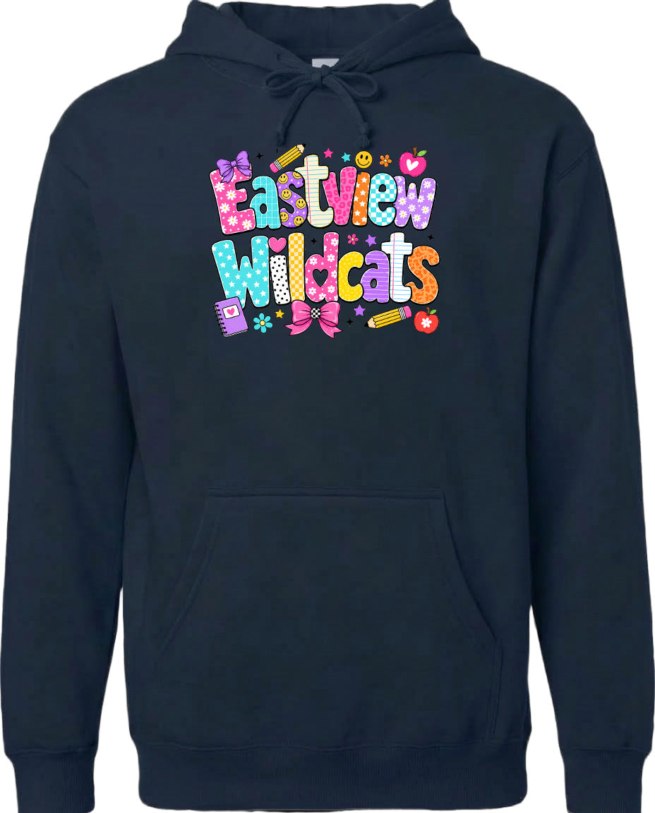 A black hoodie with a colorful graphic design featuring the text "Eastview Wildcats" and various decorative elements such as flowers, stars, and a pencil.