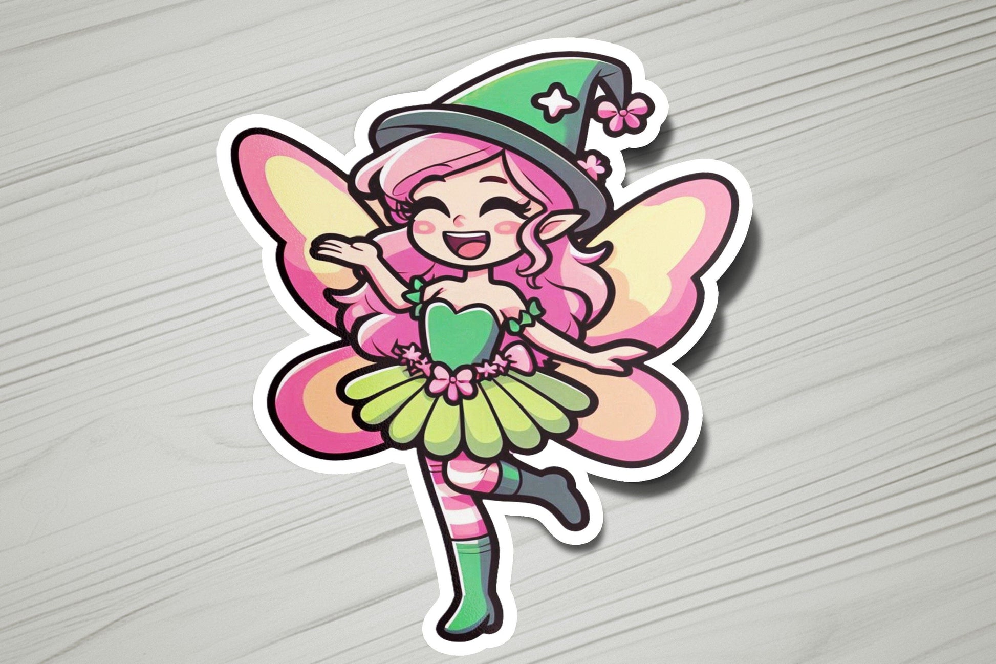 a sticker of a pink fairy with a green hat