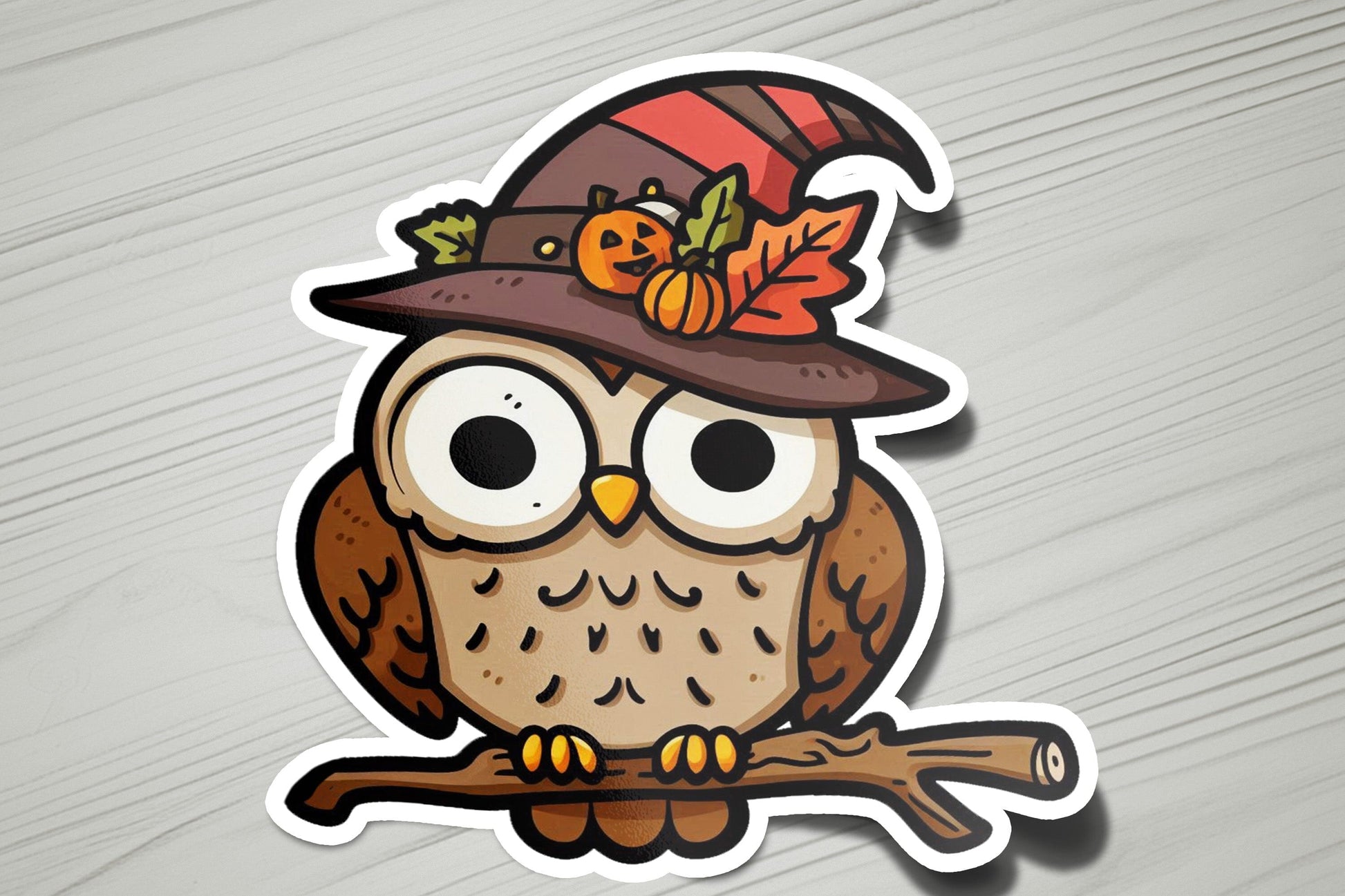 a sticker of an owl wearing a witches hat