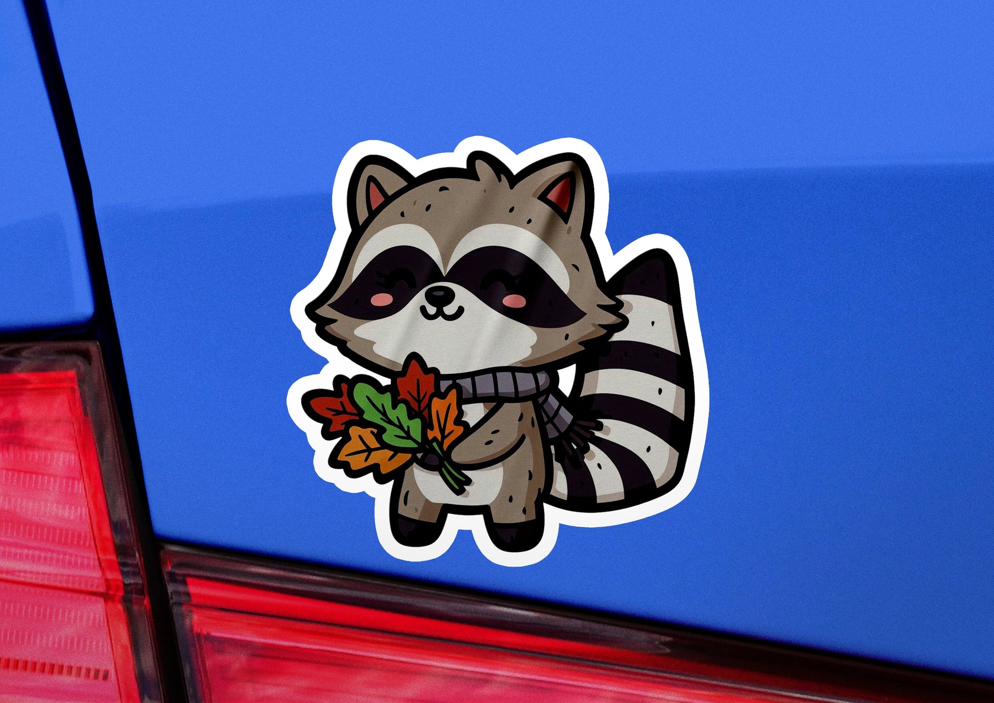 a raccoon sticker on the back of a car