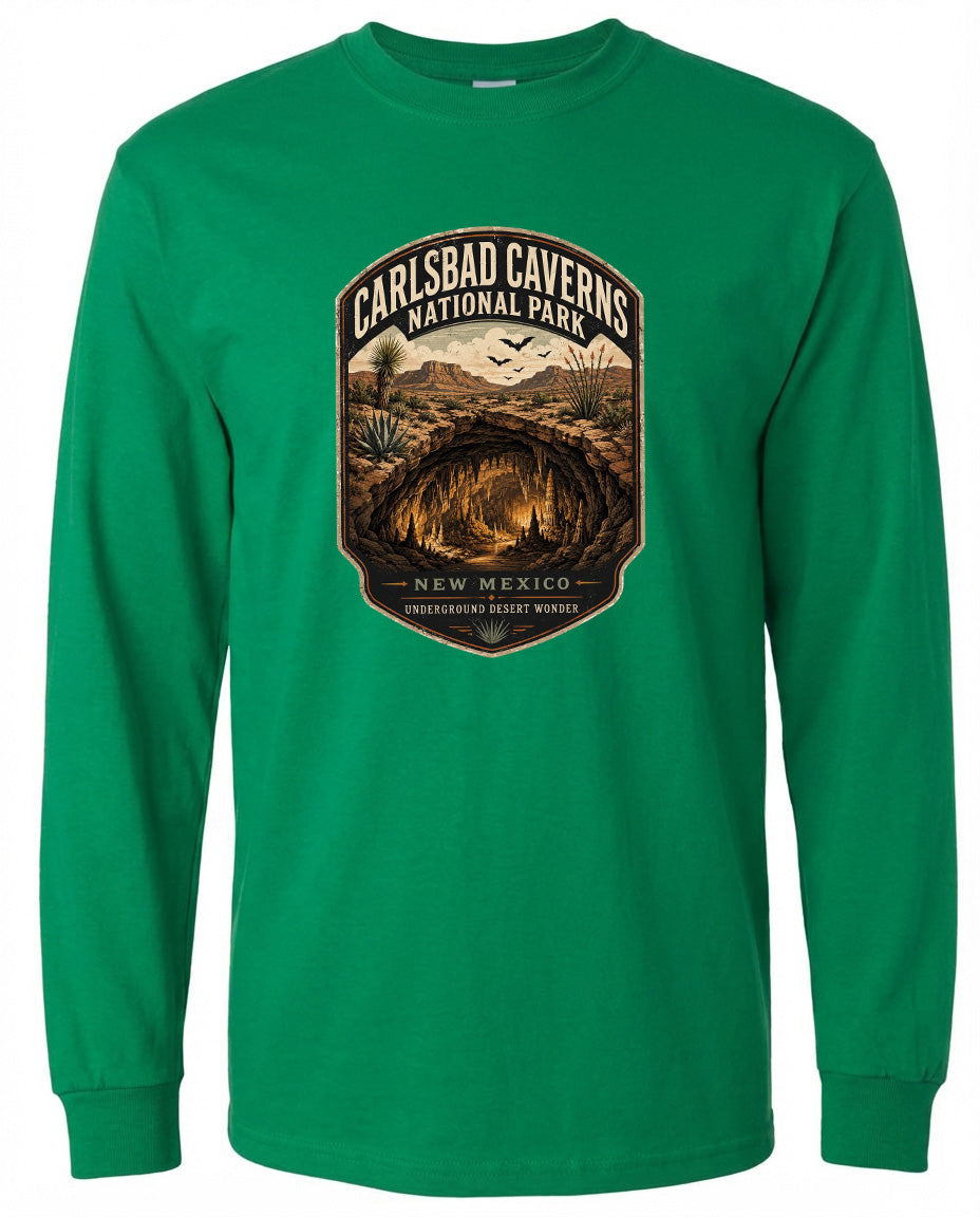 A green long-sleeved t-shirt with a graphic design depicting the entrance to Carlsbad Caverns National Park in New Mexico.
