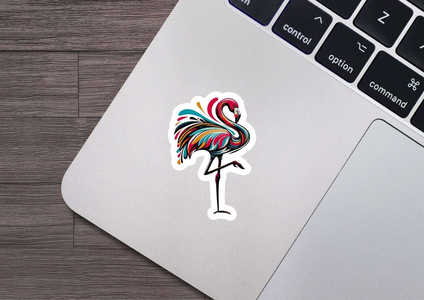 a sticker of a flamingo on a laptop
