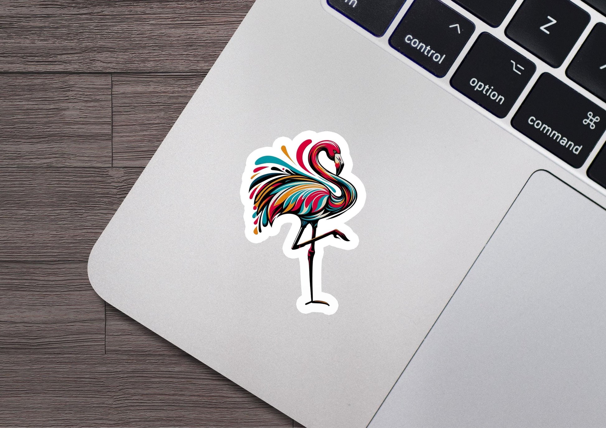 a sticker of a flamingo on a laptop
