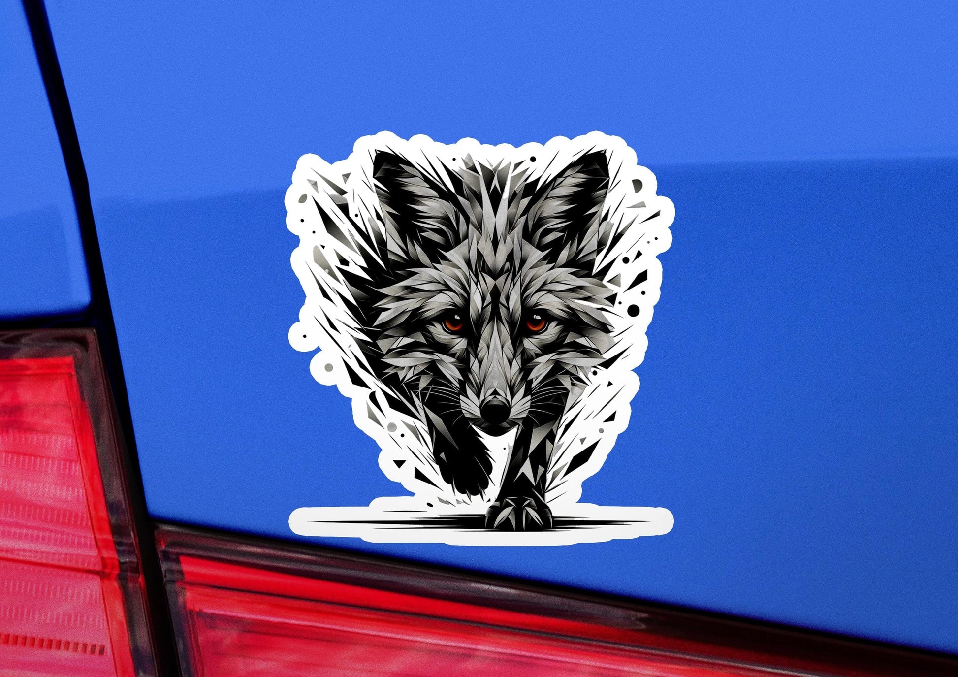 a close up of a car with a sticker of a wolf