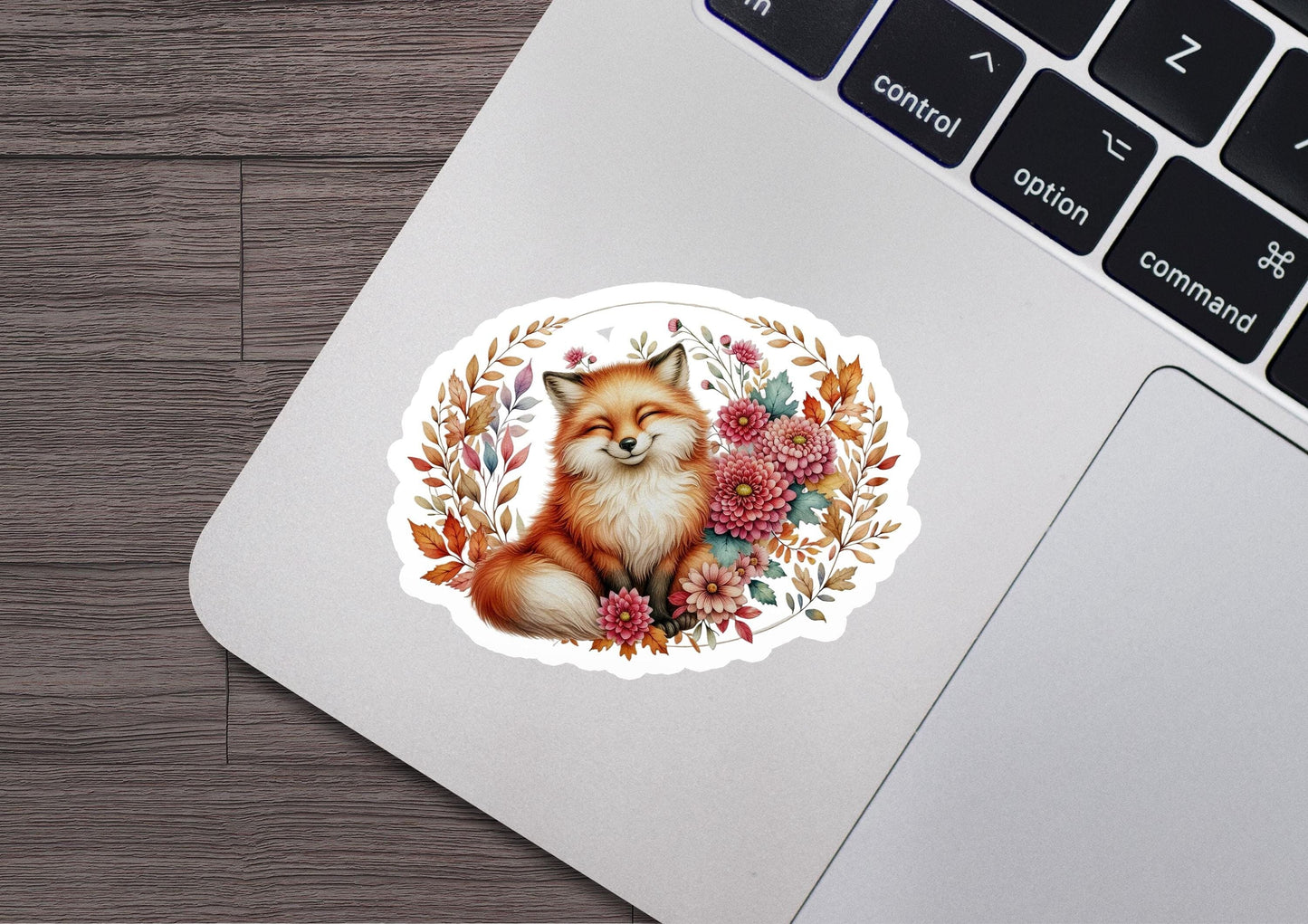 a laptop with a sticker of a fox on it