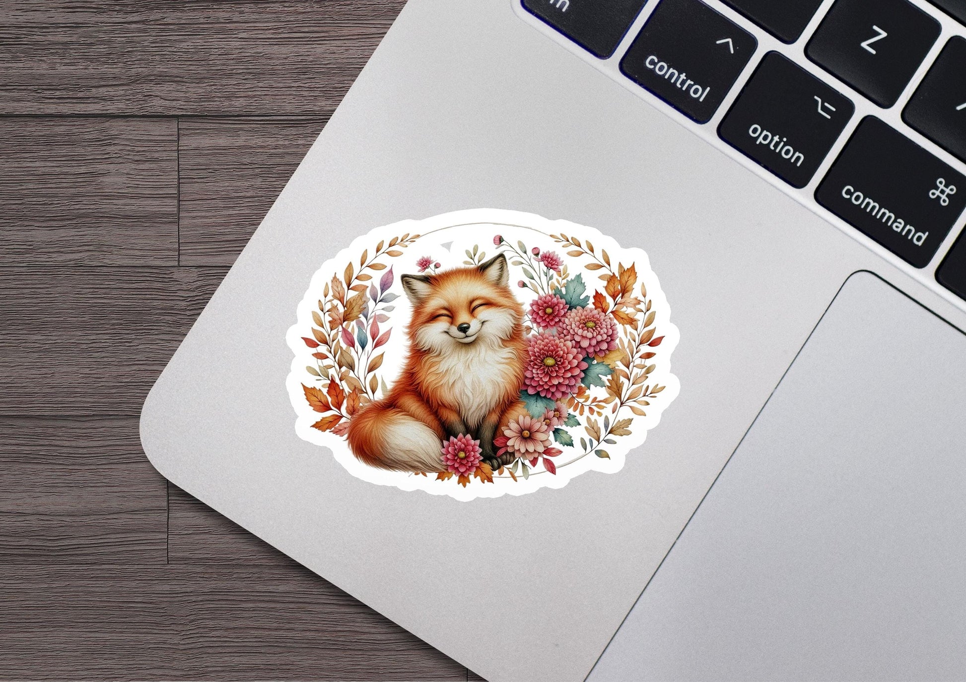 a laptop with a sticker of a fox on it