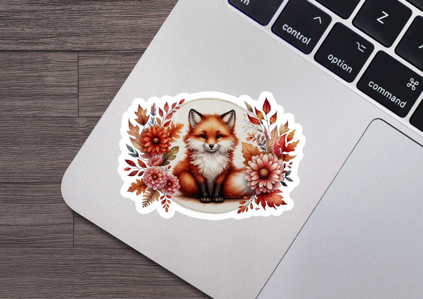 a laptop with a sticker of a fox on it