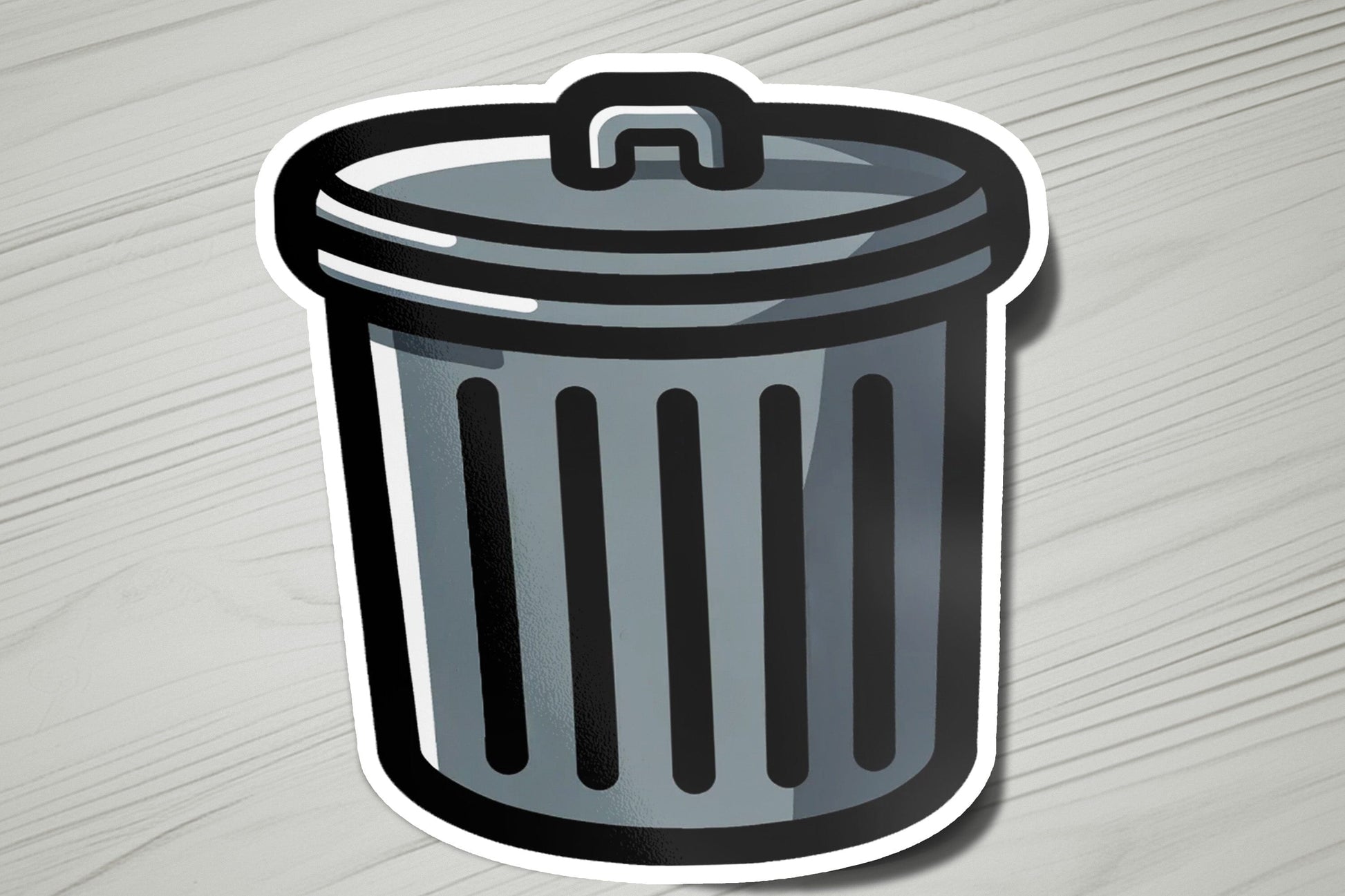 a sticker of a trash can on a table