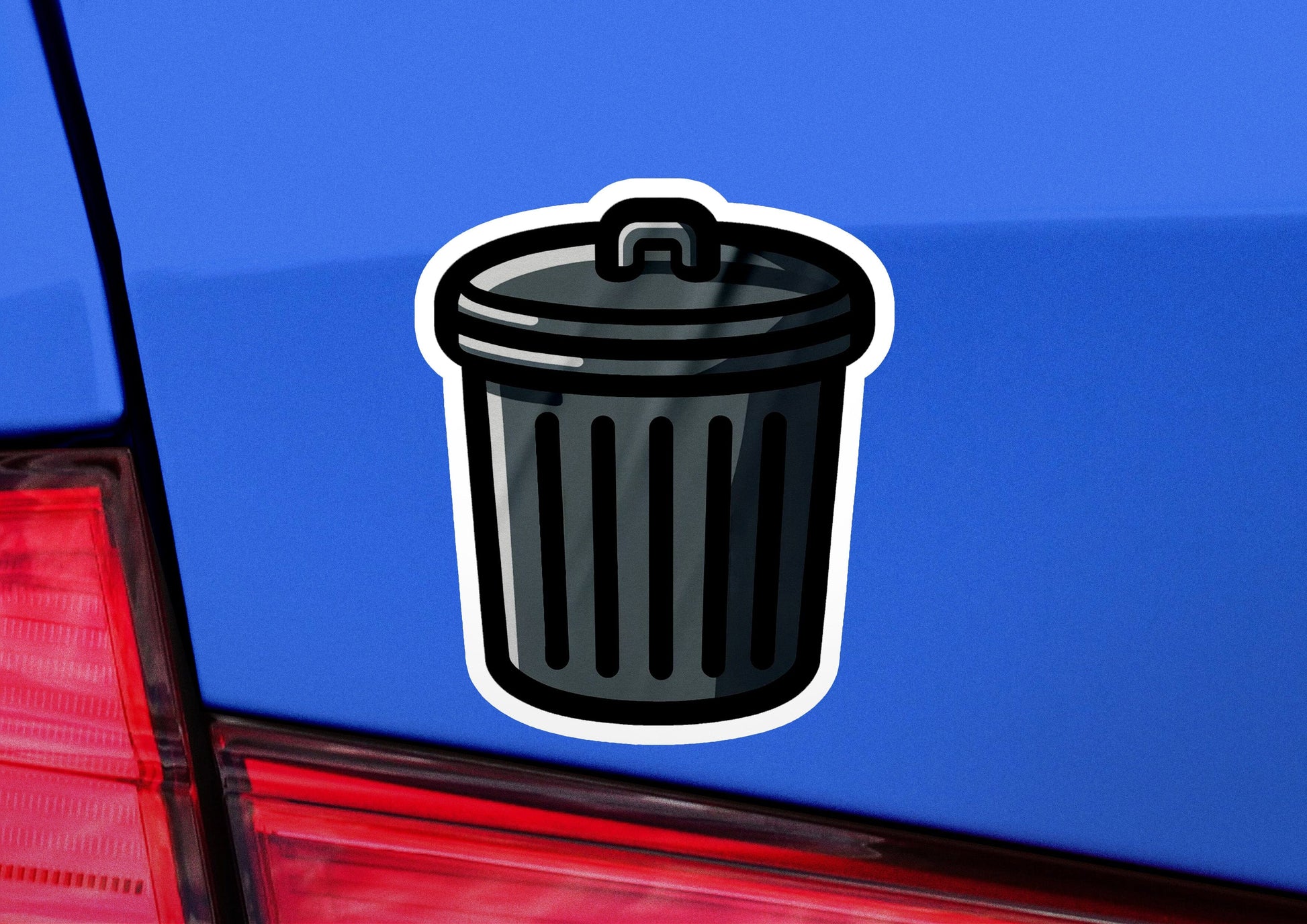 a sticker of a trash can on the back of a car