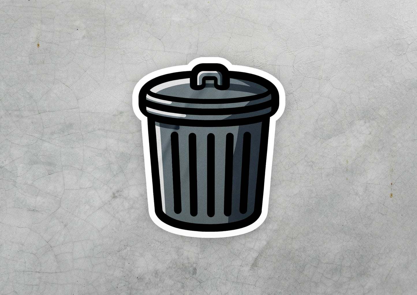 a sticker of a trash can on a concrete surface