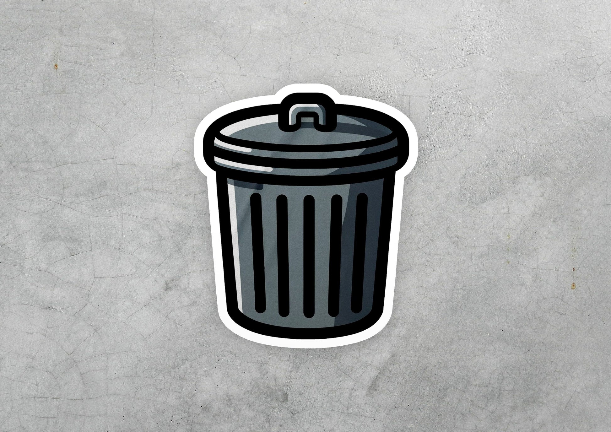 a sticker of a trash can on a concrete surface