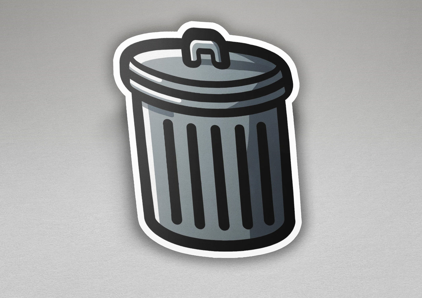 a sticker of a trash can on a gray surface