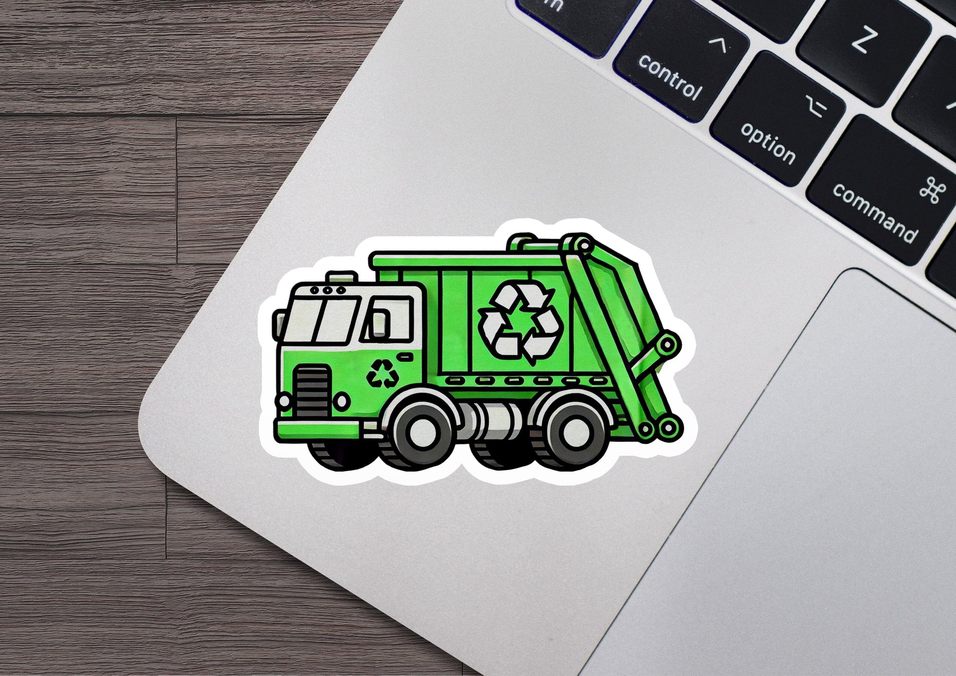 a green garbage truck sticker on a laptop