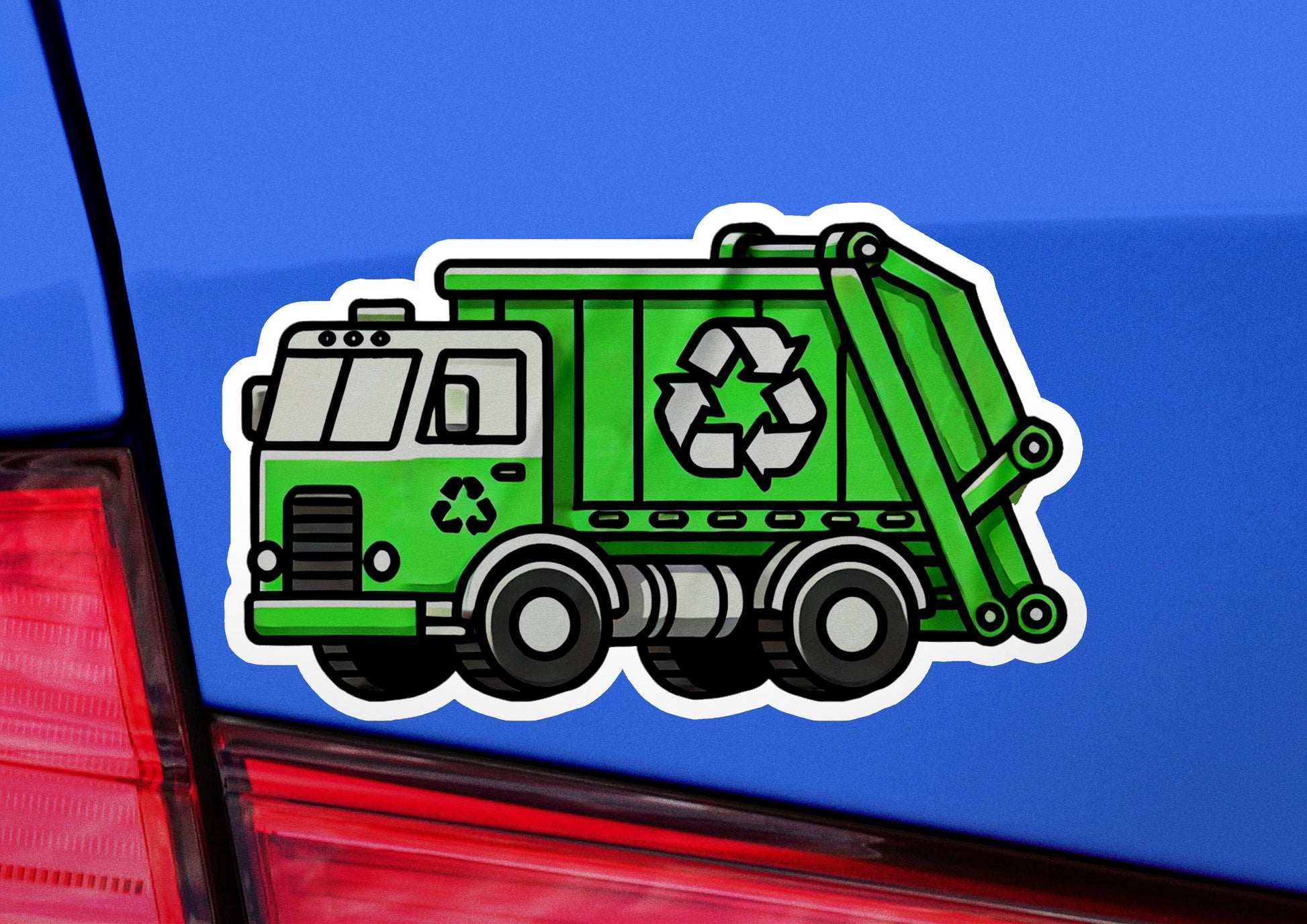 a green garbage truck sticker on the back of a car