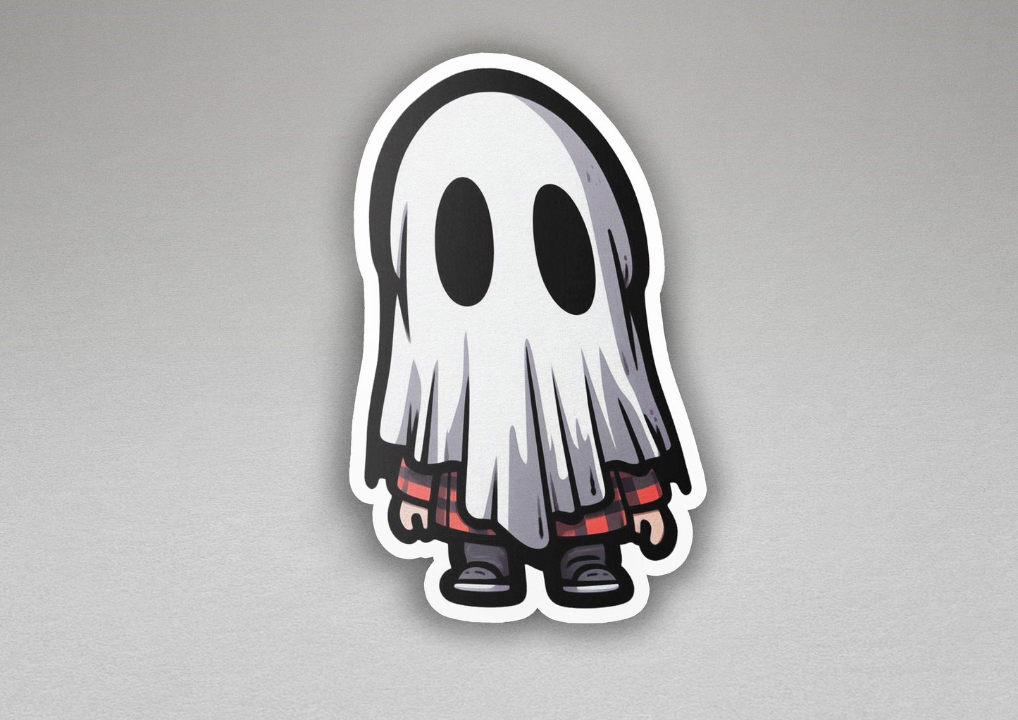 a sticker of a ghost with red eyes