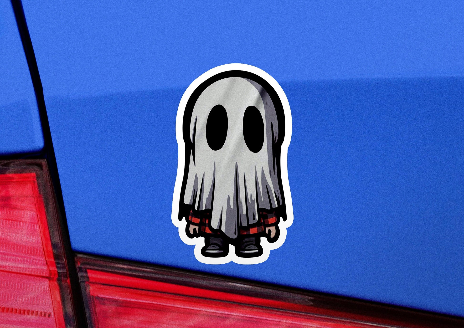 a sticker of a ghost on the back of a car