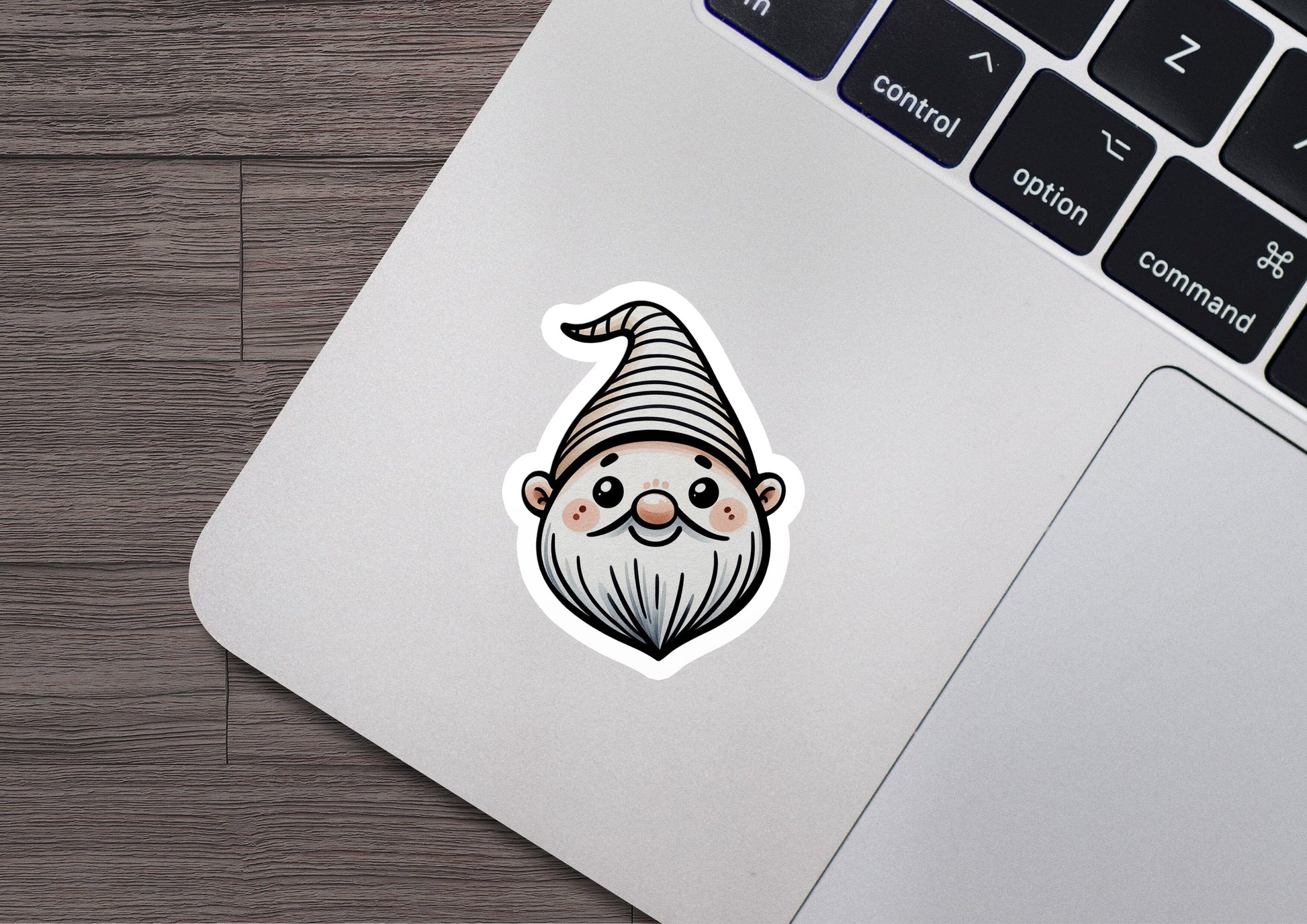 a laptop with a sticker of a gnome on it