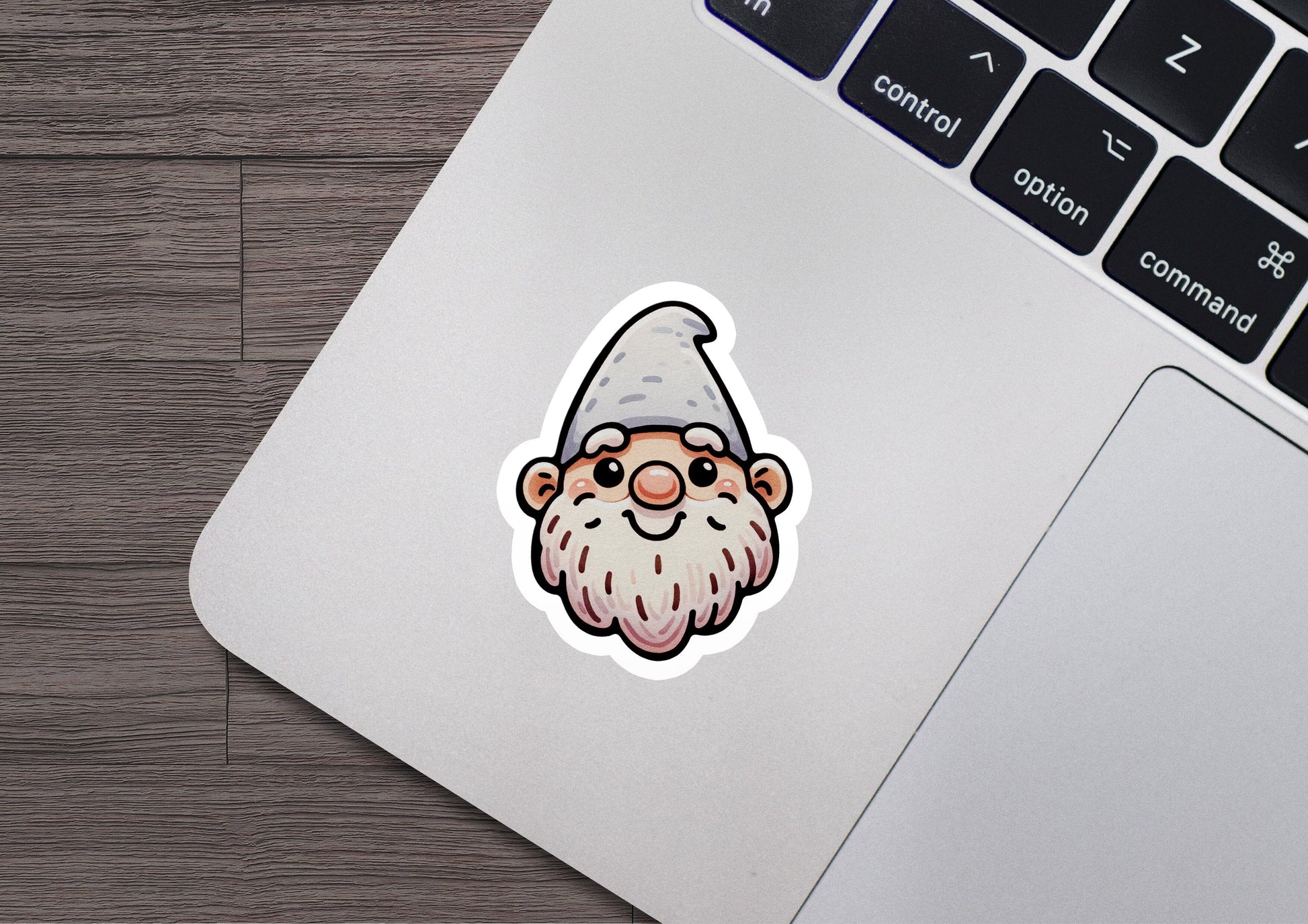 a laptop with a sticker of a gnome on it