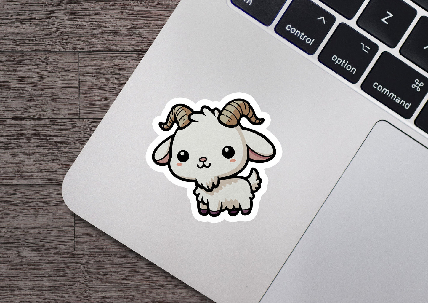 a sticker of a ram with horns on a laptop