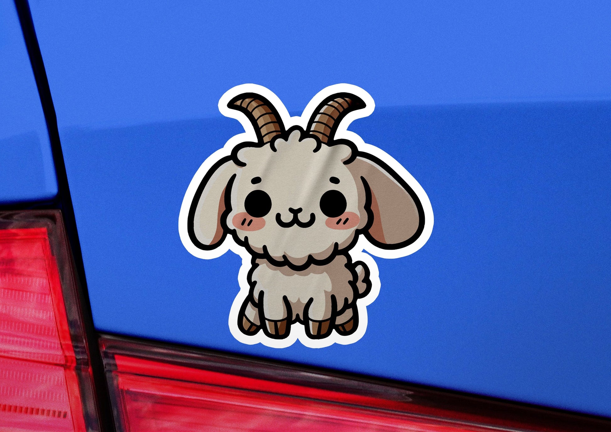 a sticker of a goat on the back of a car