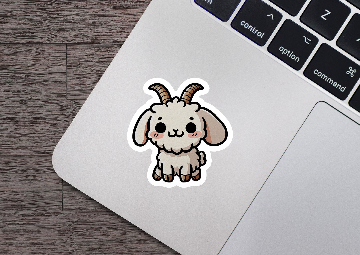 a sticker of a goat on a laptop
