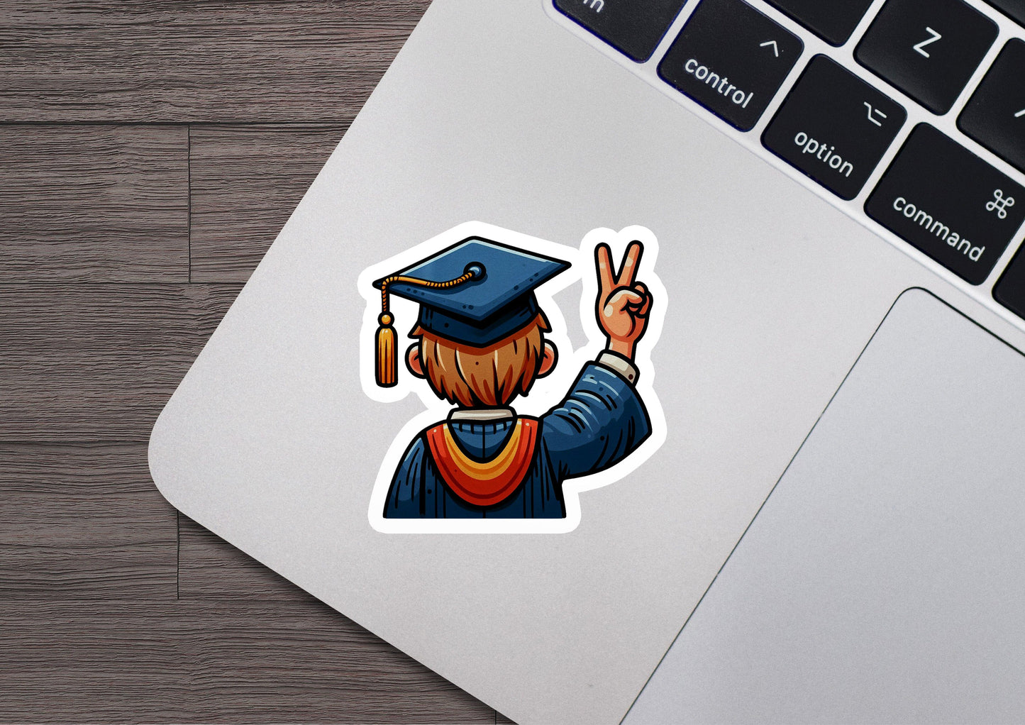 a laptop with a sticker of a man in a graduation cap