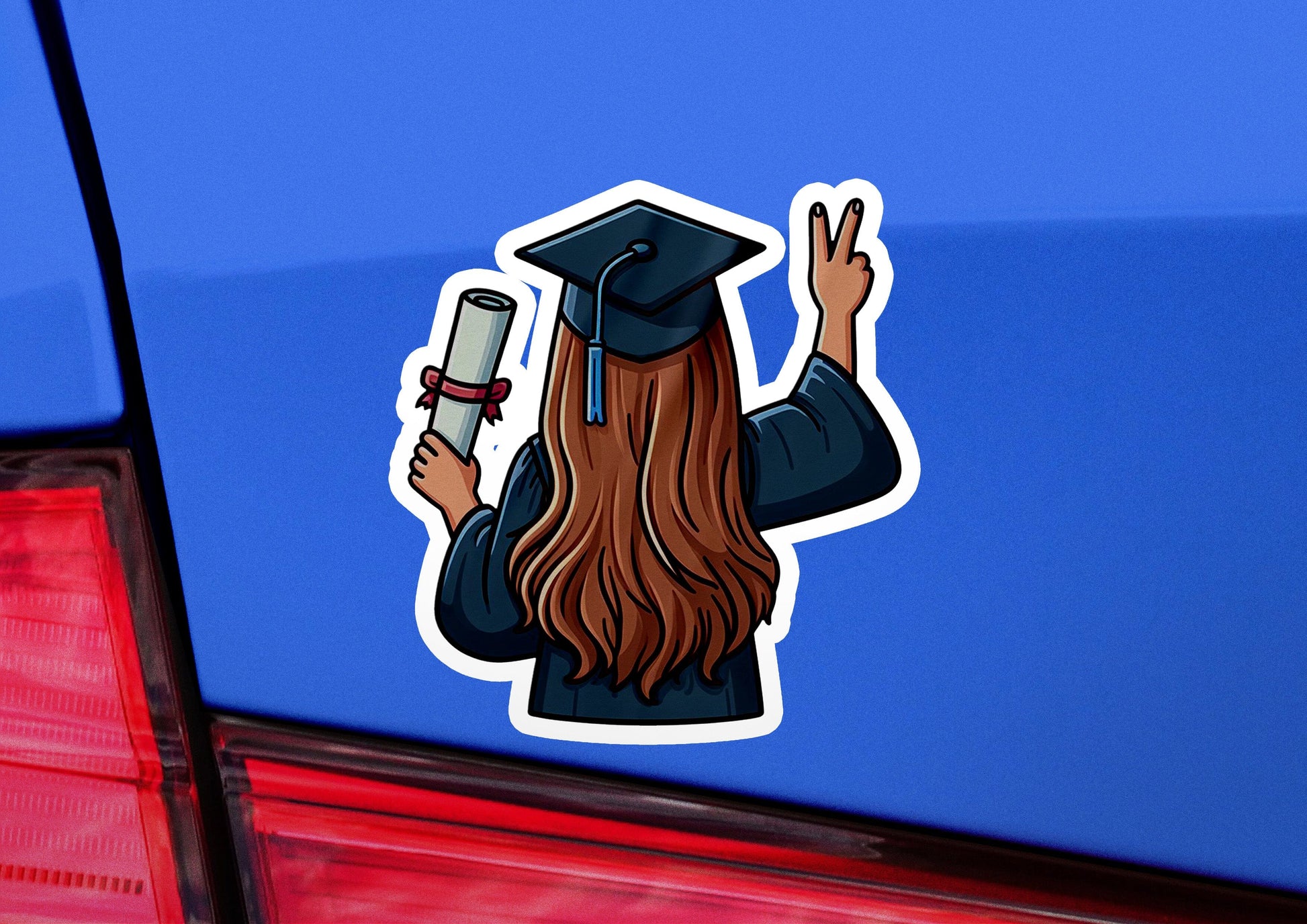 a sticker of a graduate holding a diploma