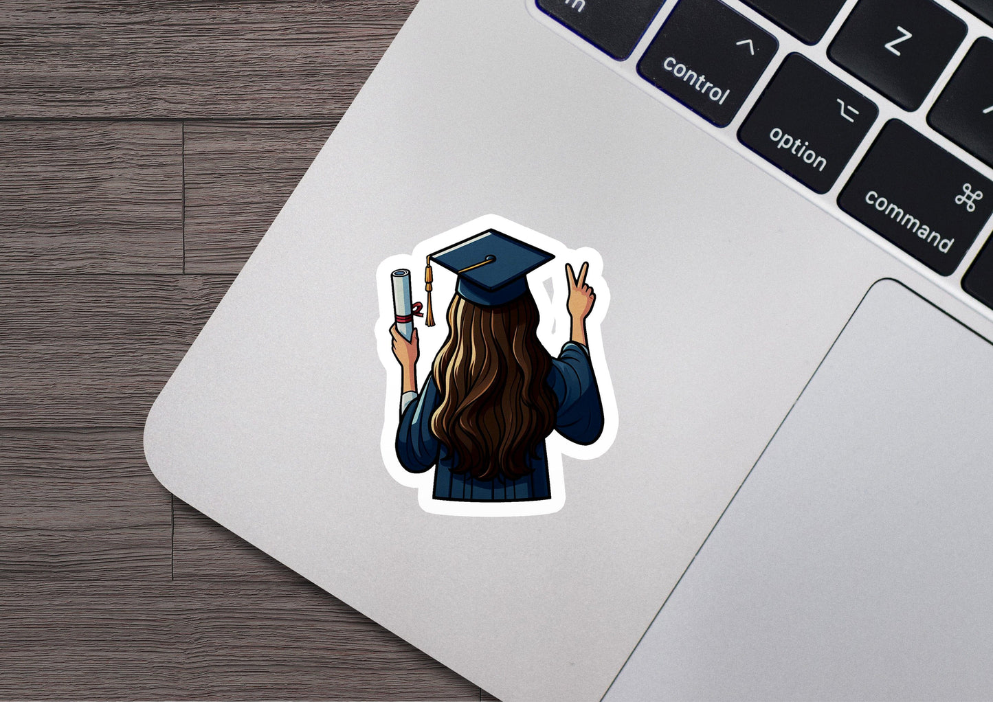 a sticker of a girl in a graduation cap holding a cell phone