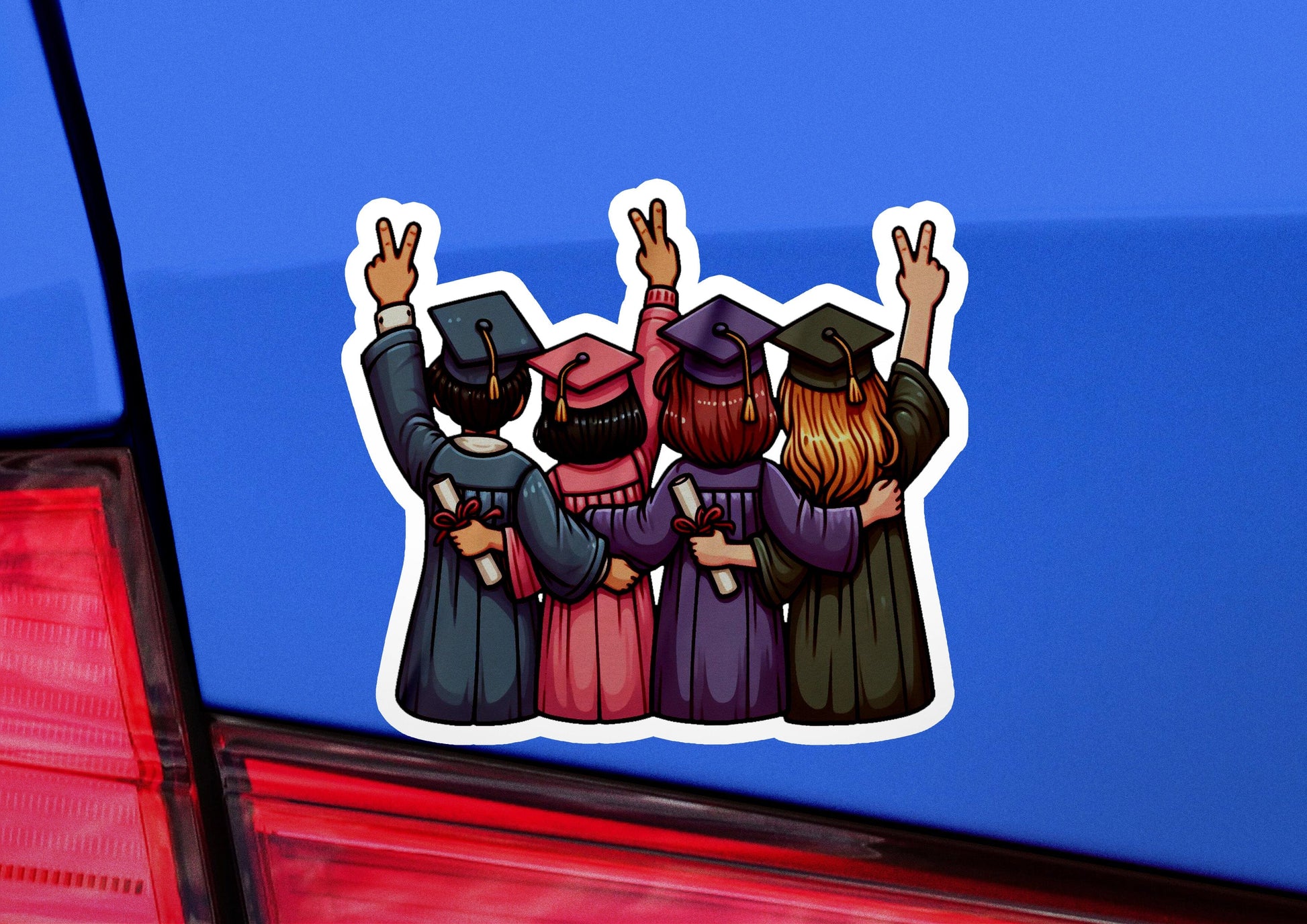 a car with a sticker of three graduates on it