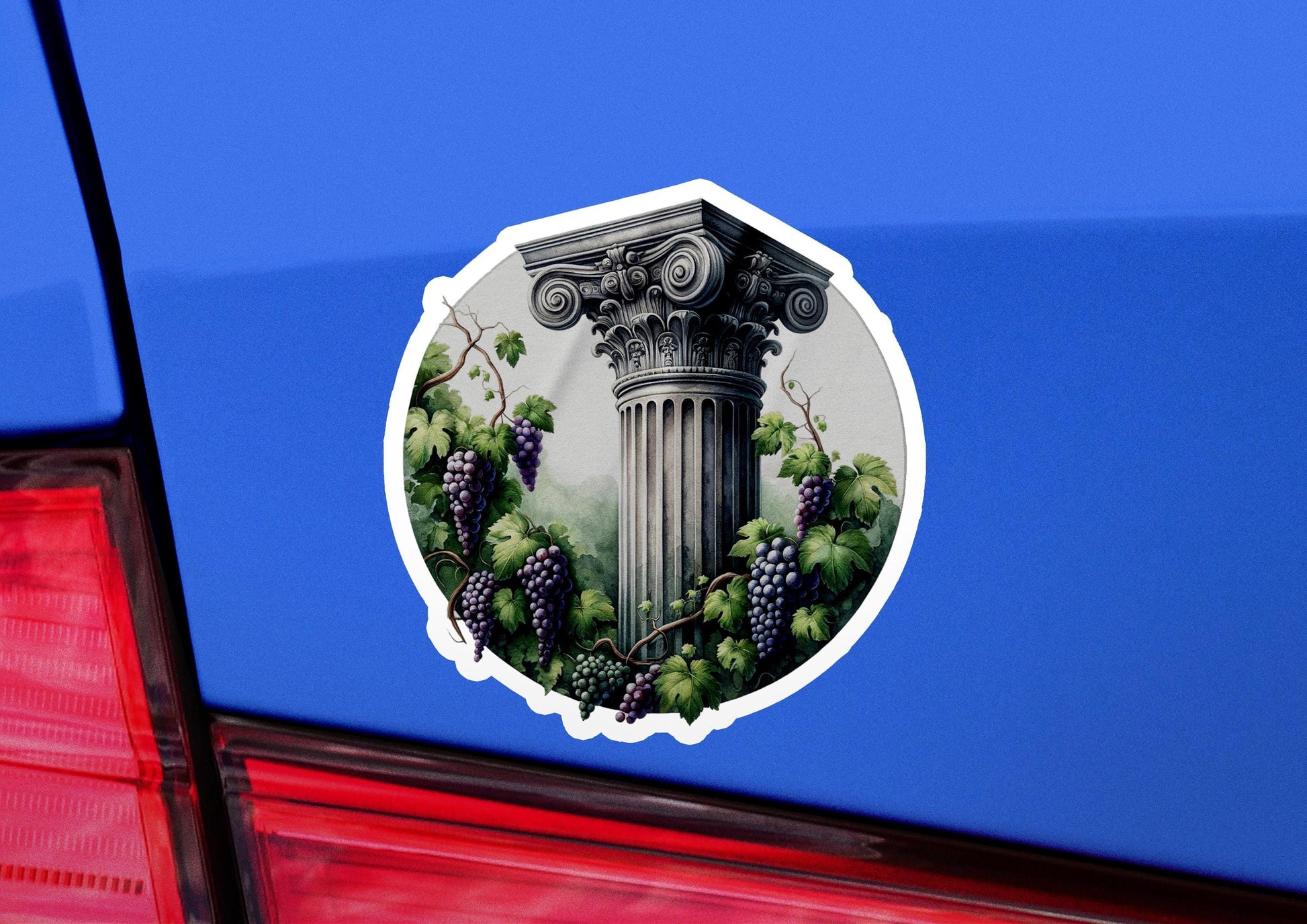 a sticker of grapes and a pillar on a car