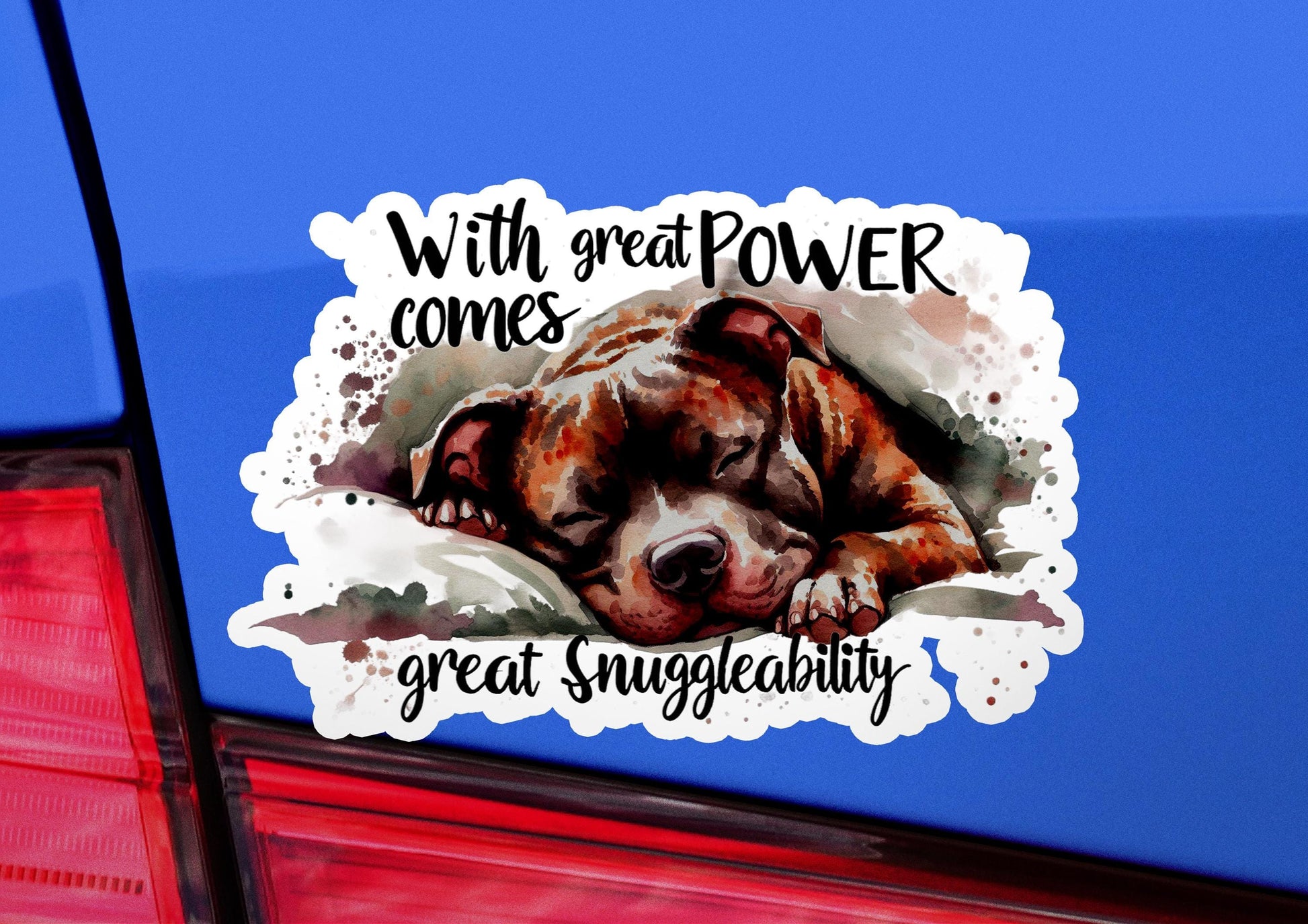 a sticker of a dog sleeping on the back of a car