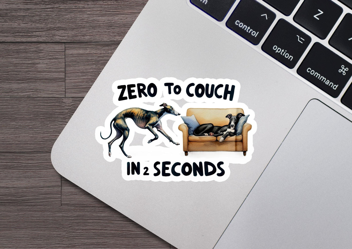 a laptop with a sticker of two dogs on it