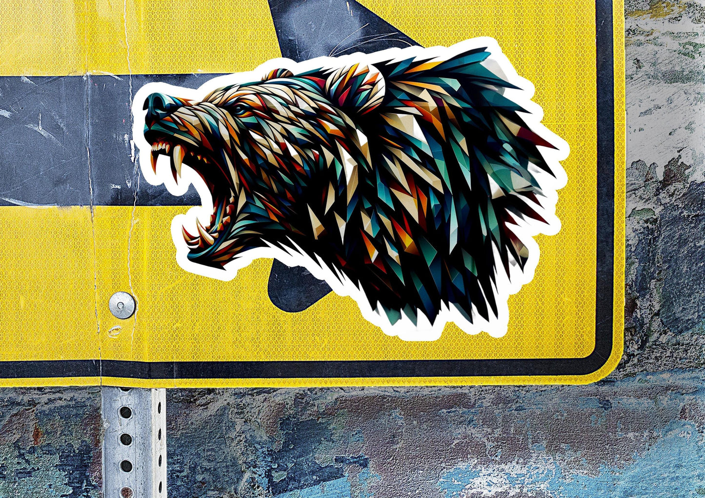 a bear sticker on a yellow street sign