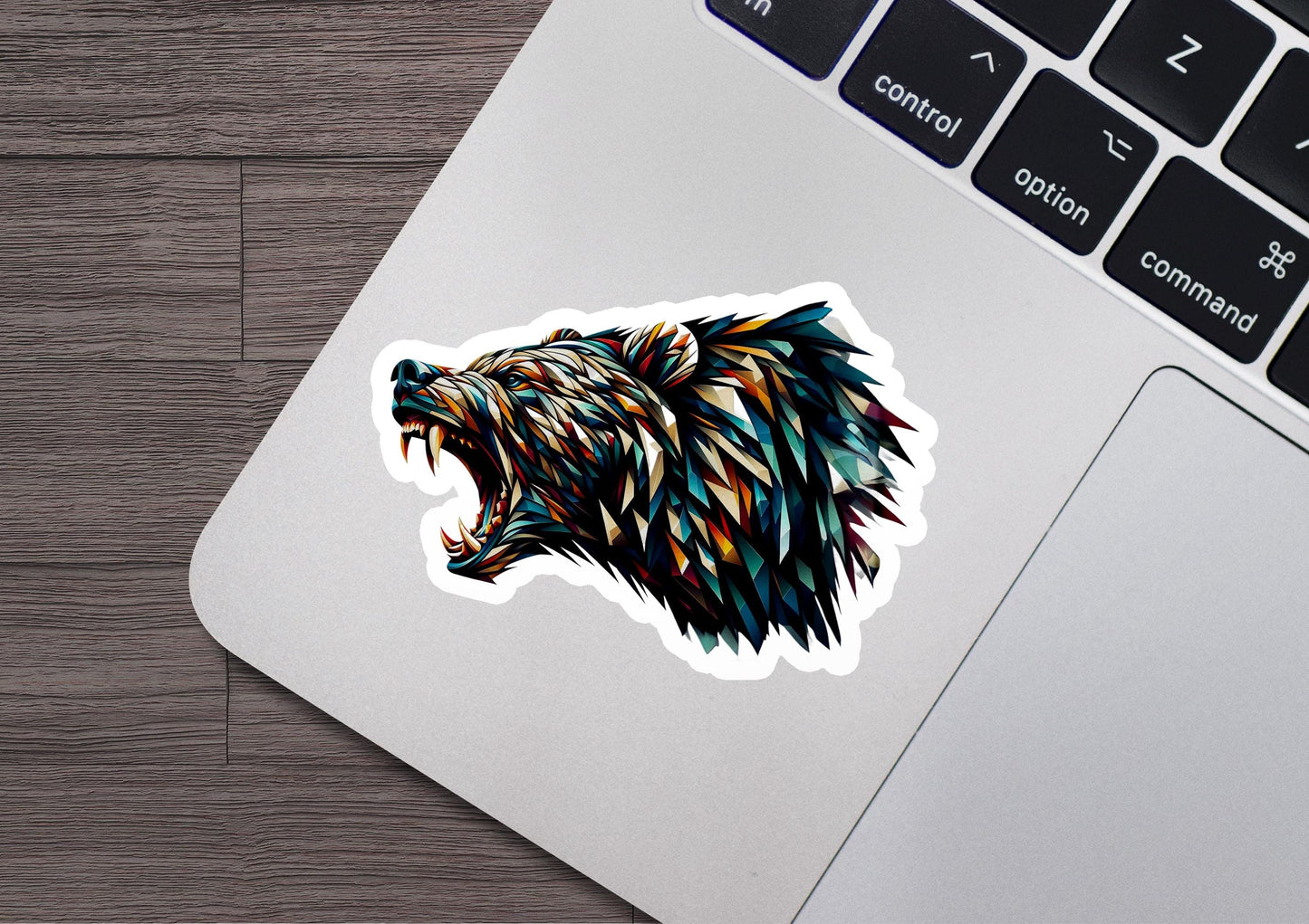 a sticker of a bear&#39;s head on a laptop
