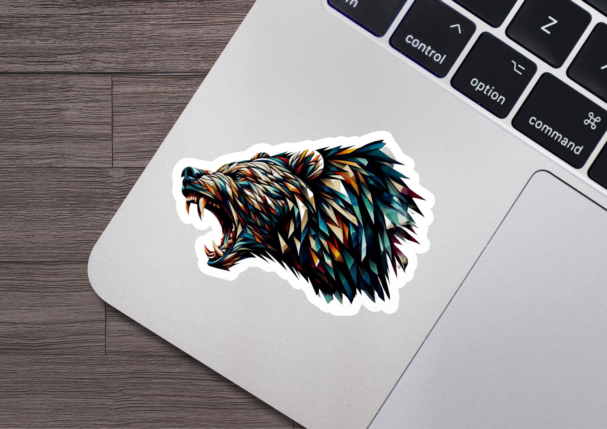 a sticker of a bear&#39;s head on a laptop