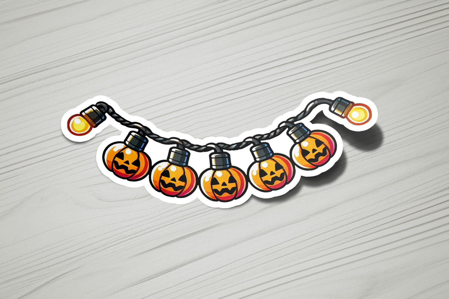 a string of lights with jack - o - lanterns on them