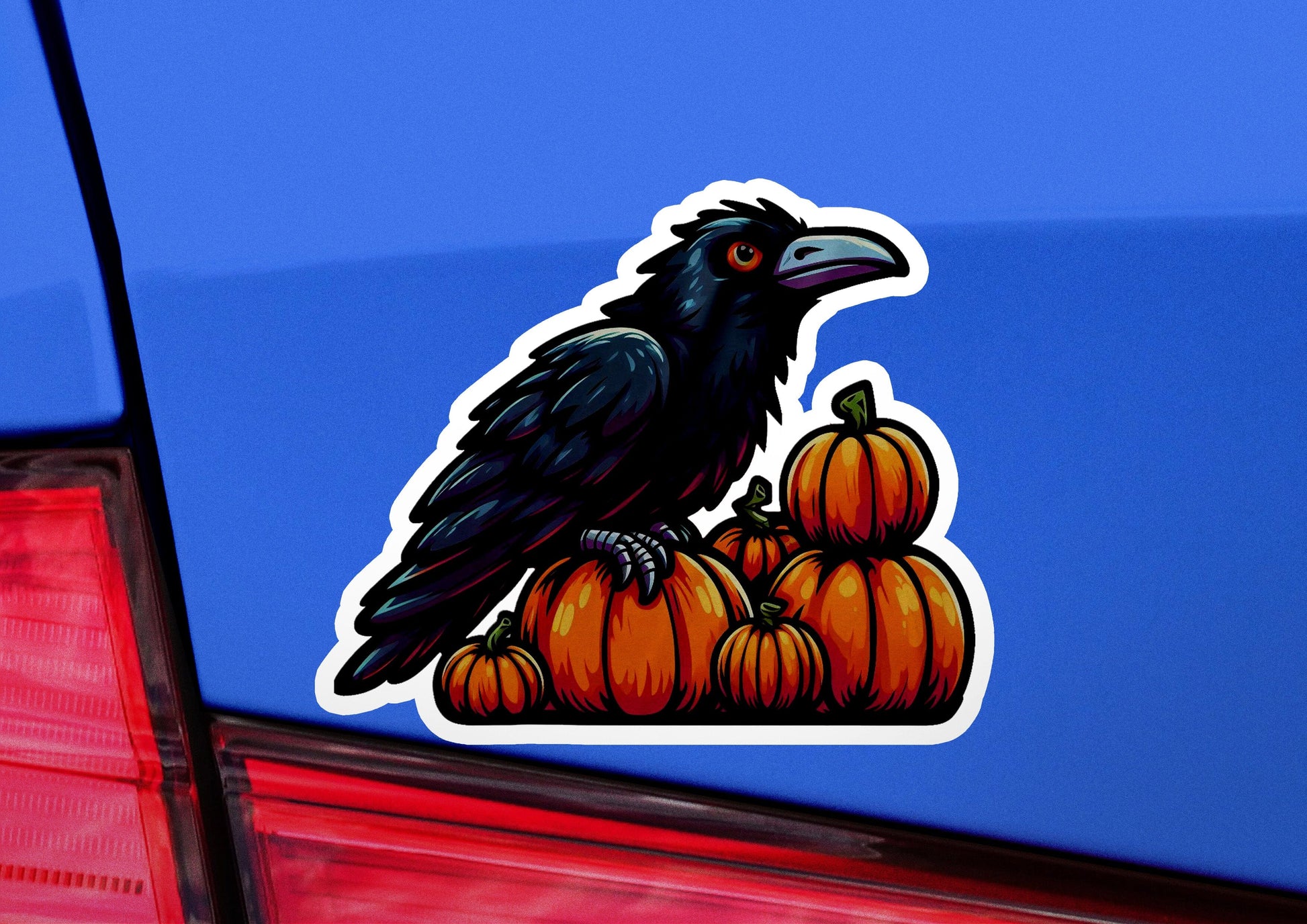 a black bird sitting on top of a pile of pumpkins