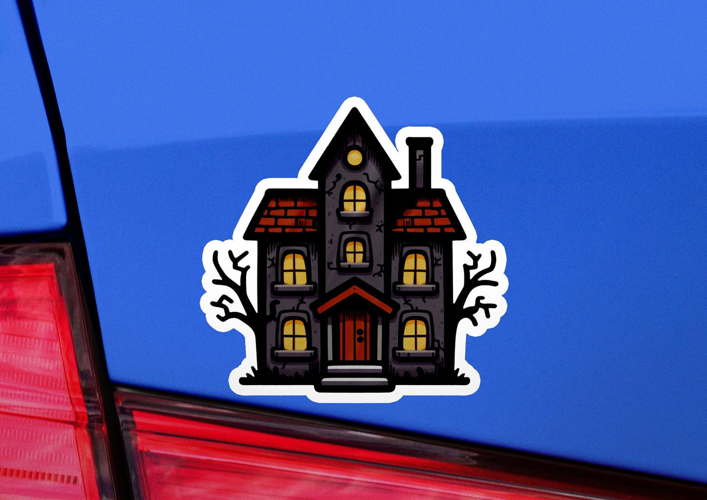 a sticker of a house on the back of a car