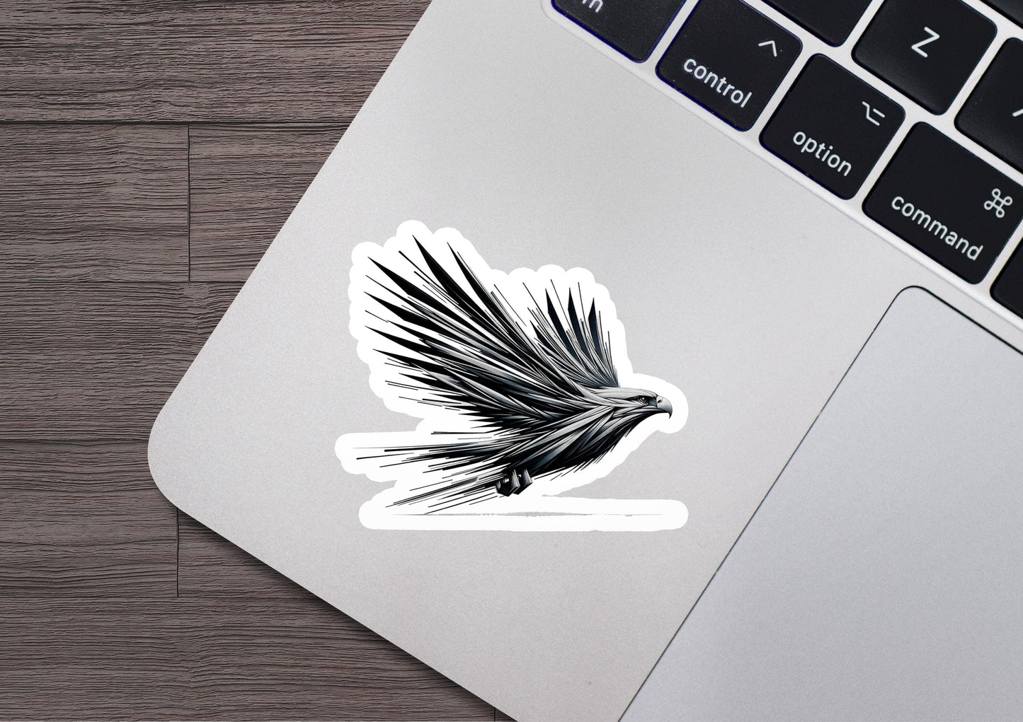 a sticker of a bird on a laptop