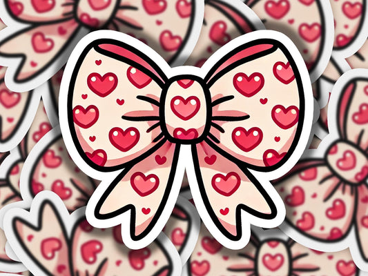 a sticker of a bow with hearts on it