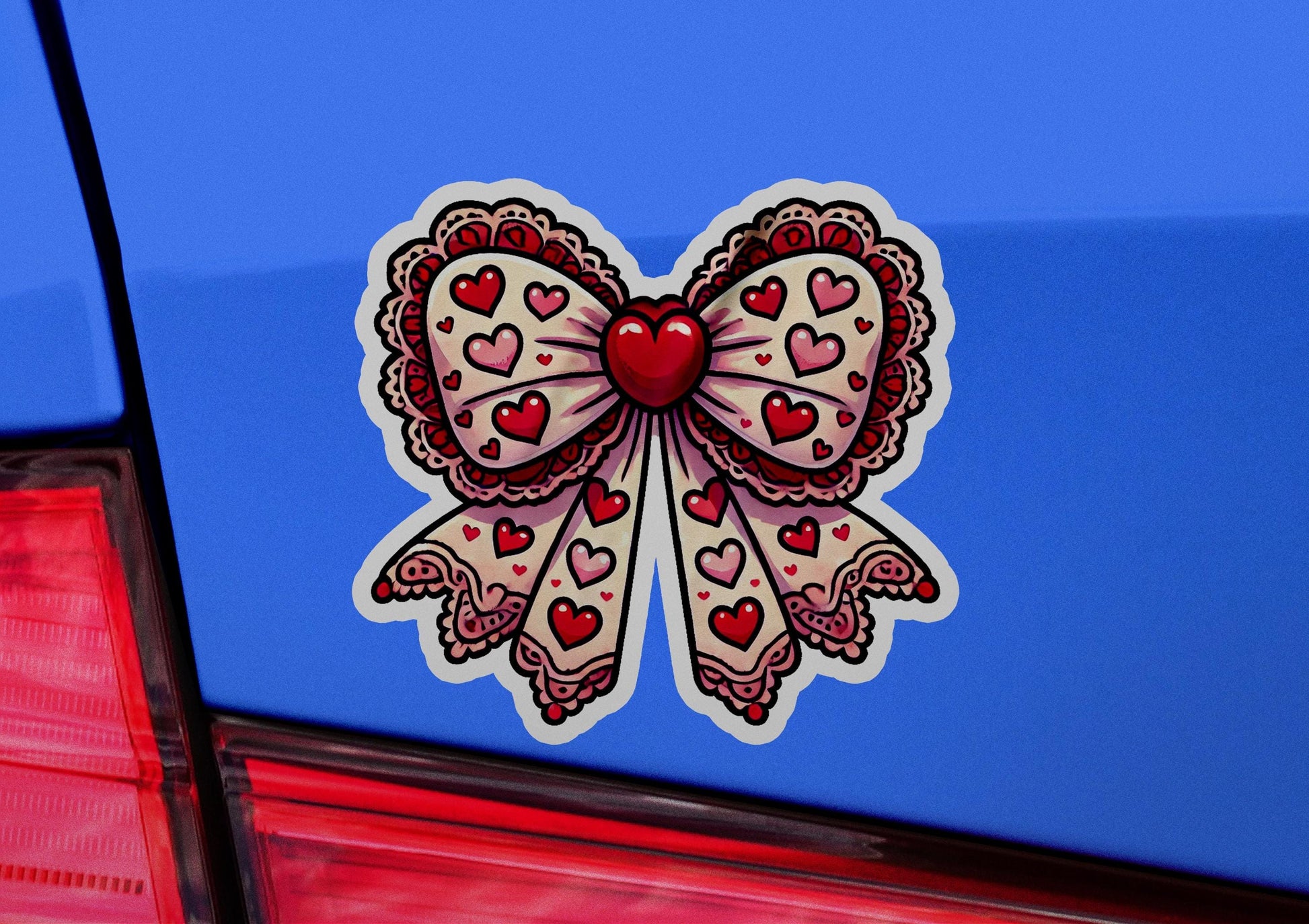 a heart shaped sticker on the back of a car