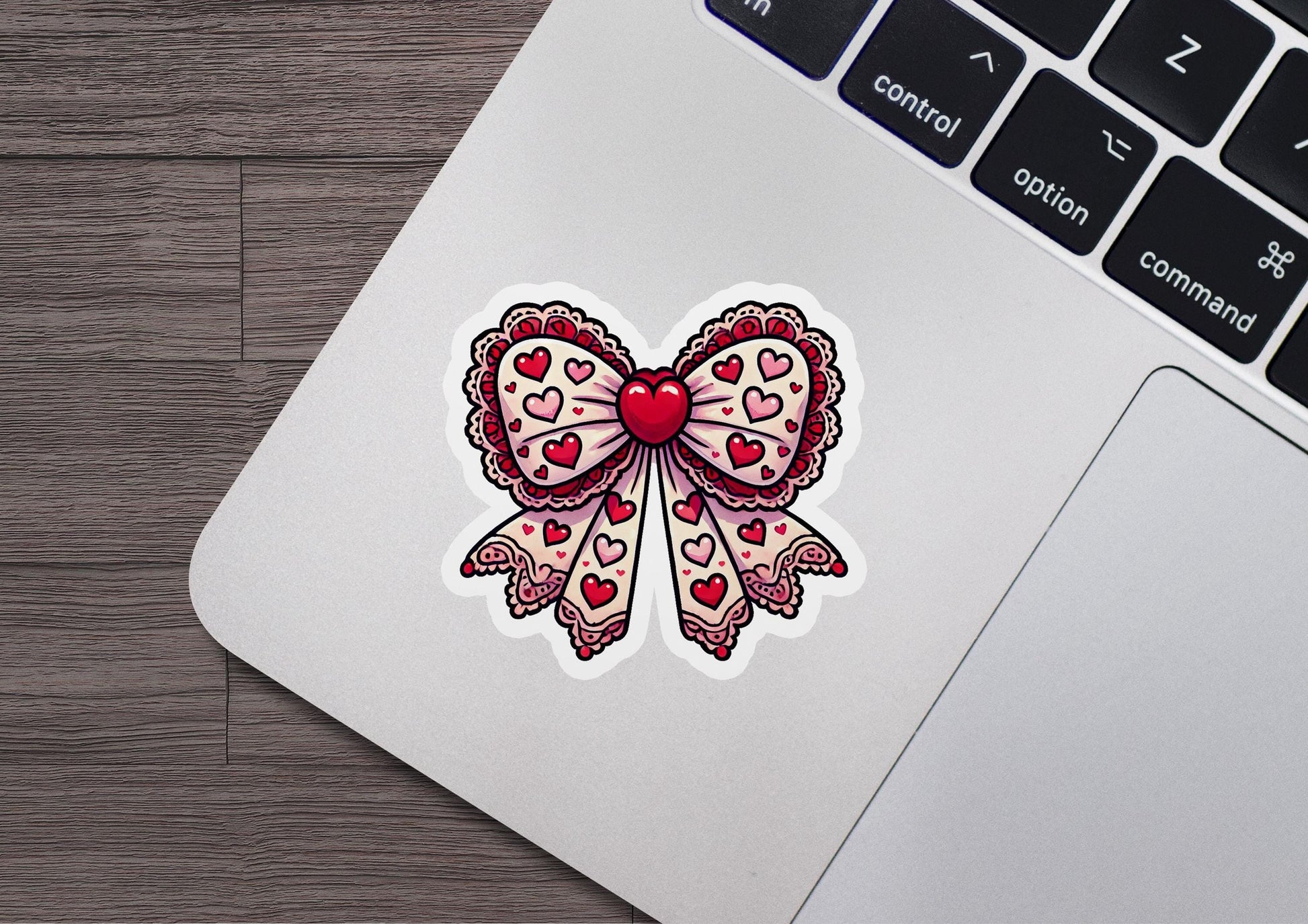 a laptop computer with a sticker of a heart on it