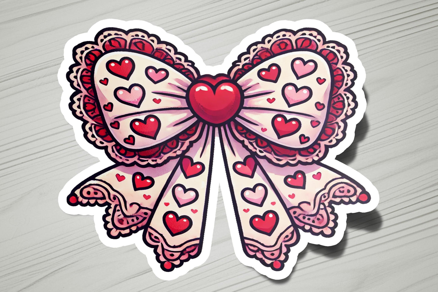 a sticker of a bow with hearts on it