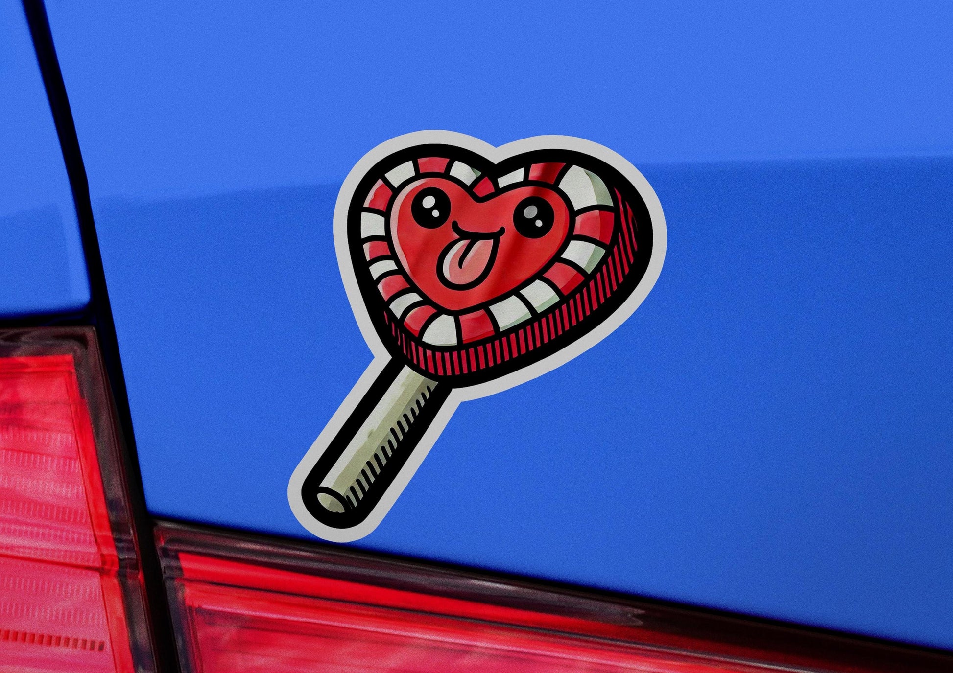 a heart shaped sticker on the back of a car