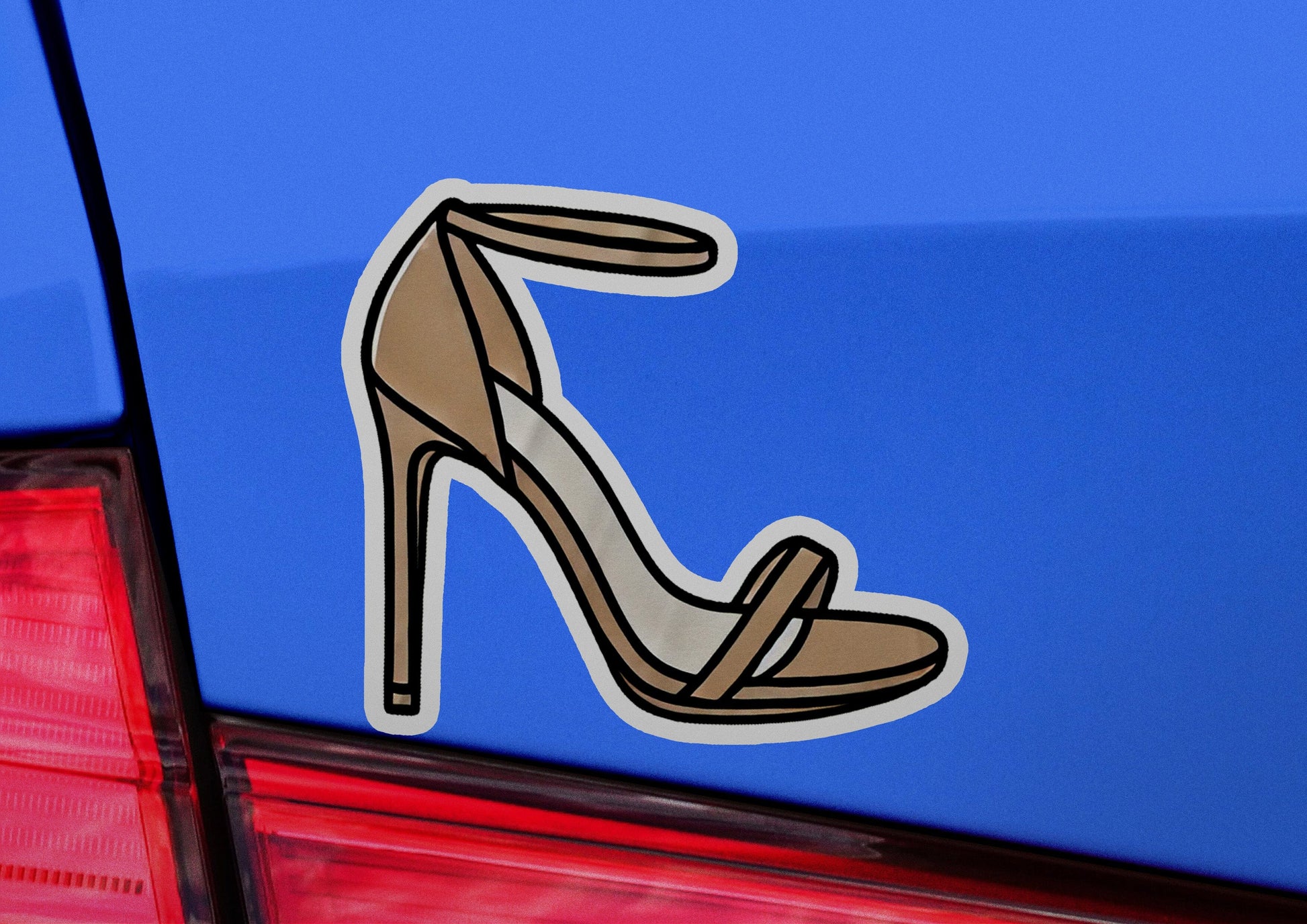 a pair of high heeled shoes sticker on the back of a car