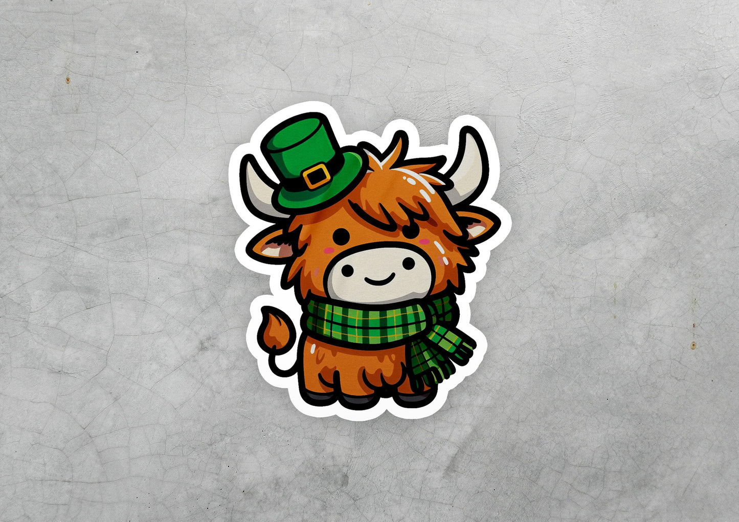 a sticker of a cow wearing a green hat and scarf
