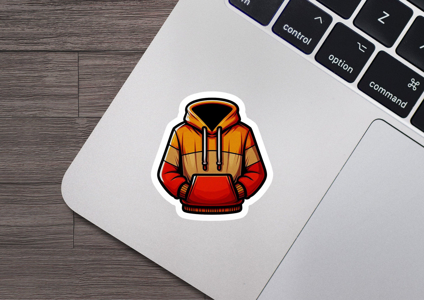 a laptop with a sticker of a hoodie on it