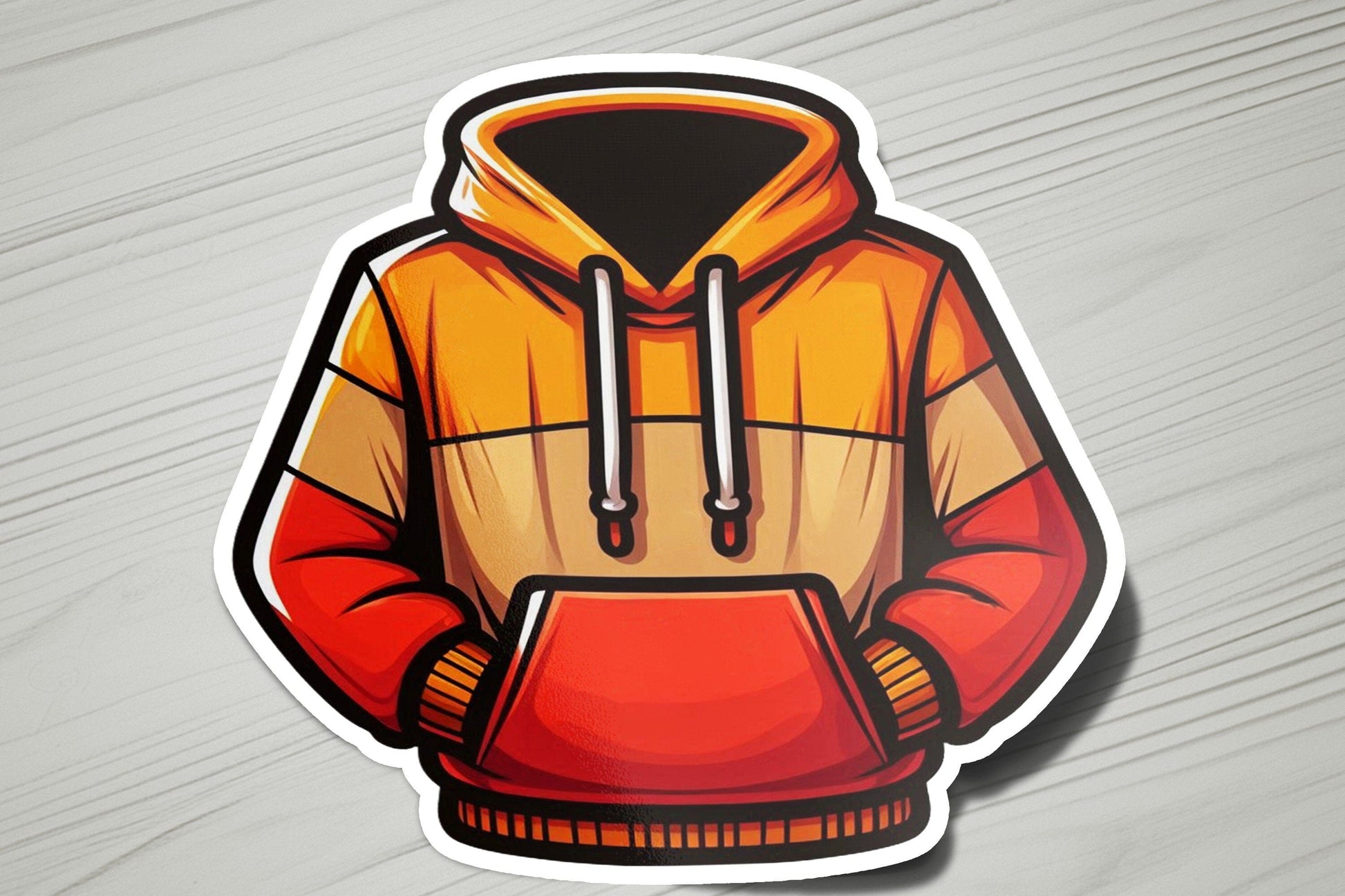 a sticker of a hoodie on a table