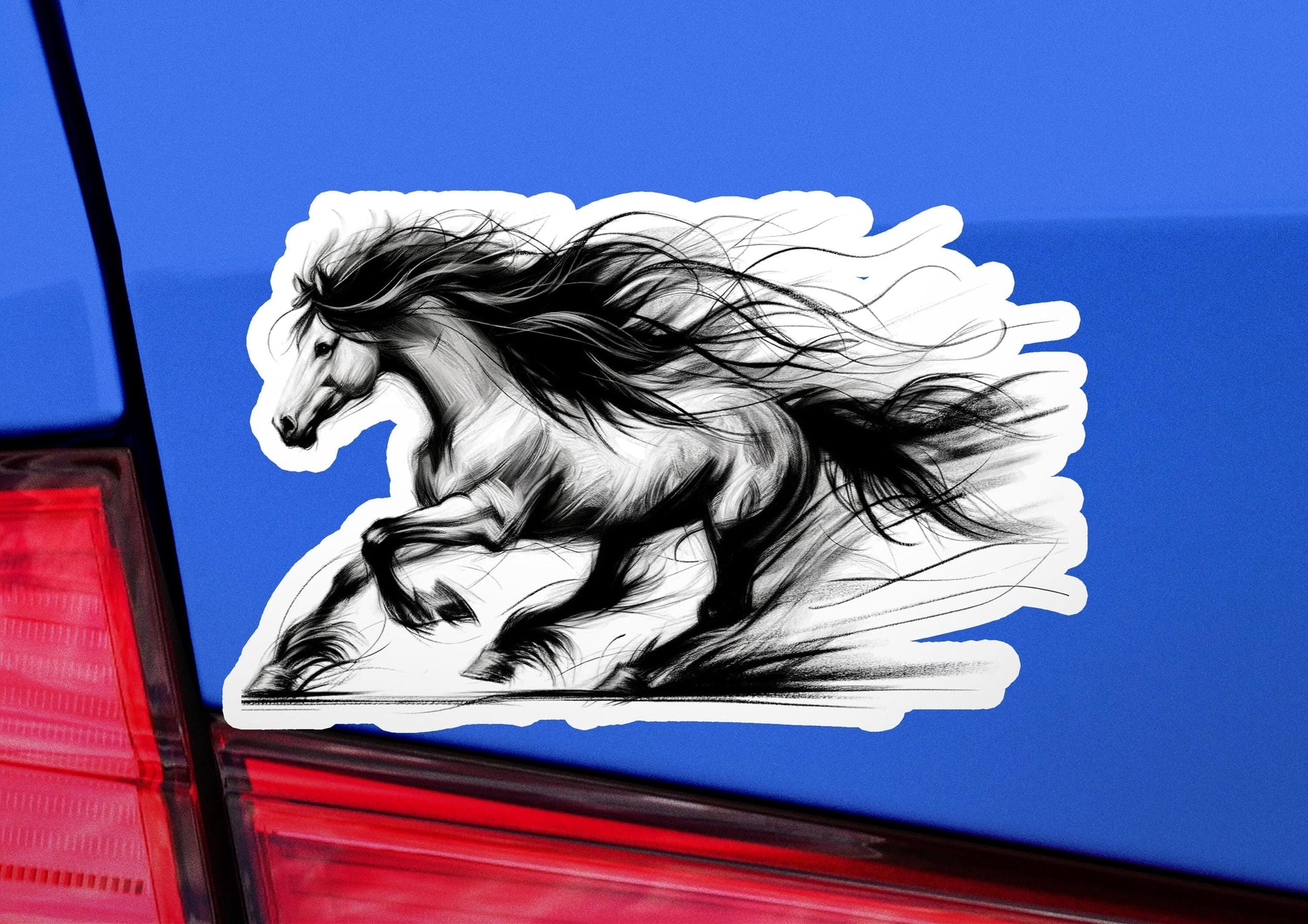 a sticker of a running horse on the back of a car