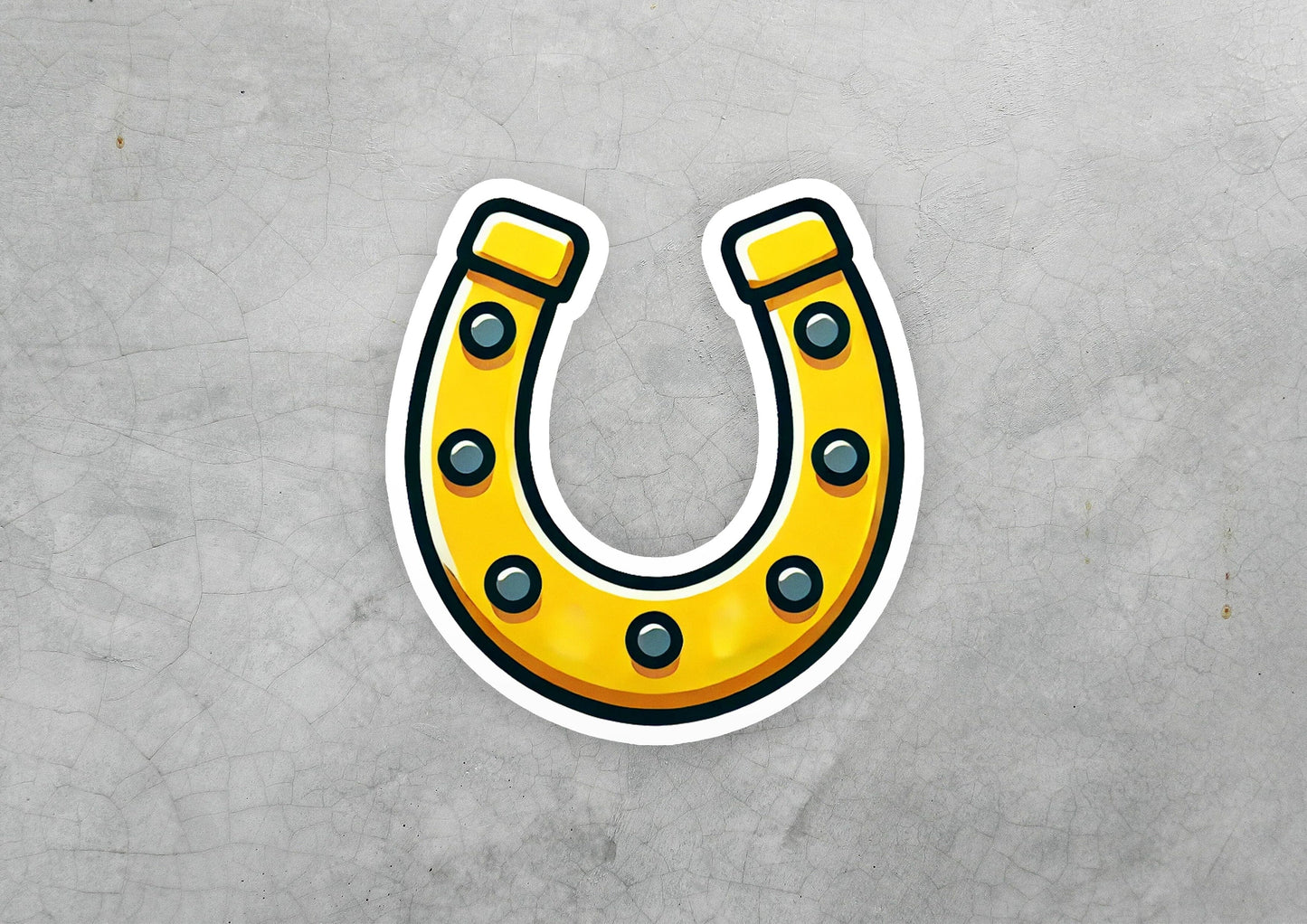 a sticker of a yellow horseshoe on a gray background
